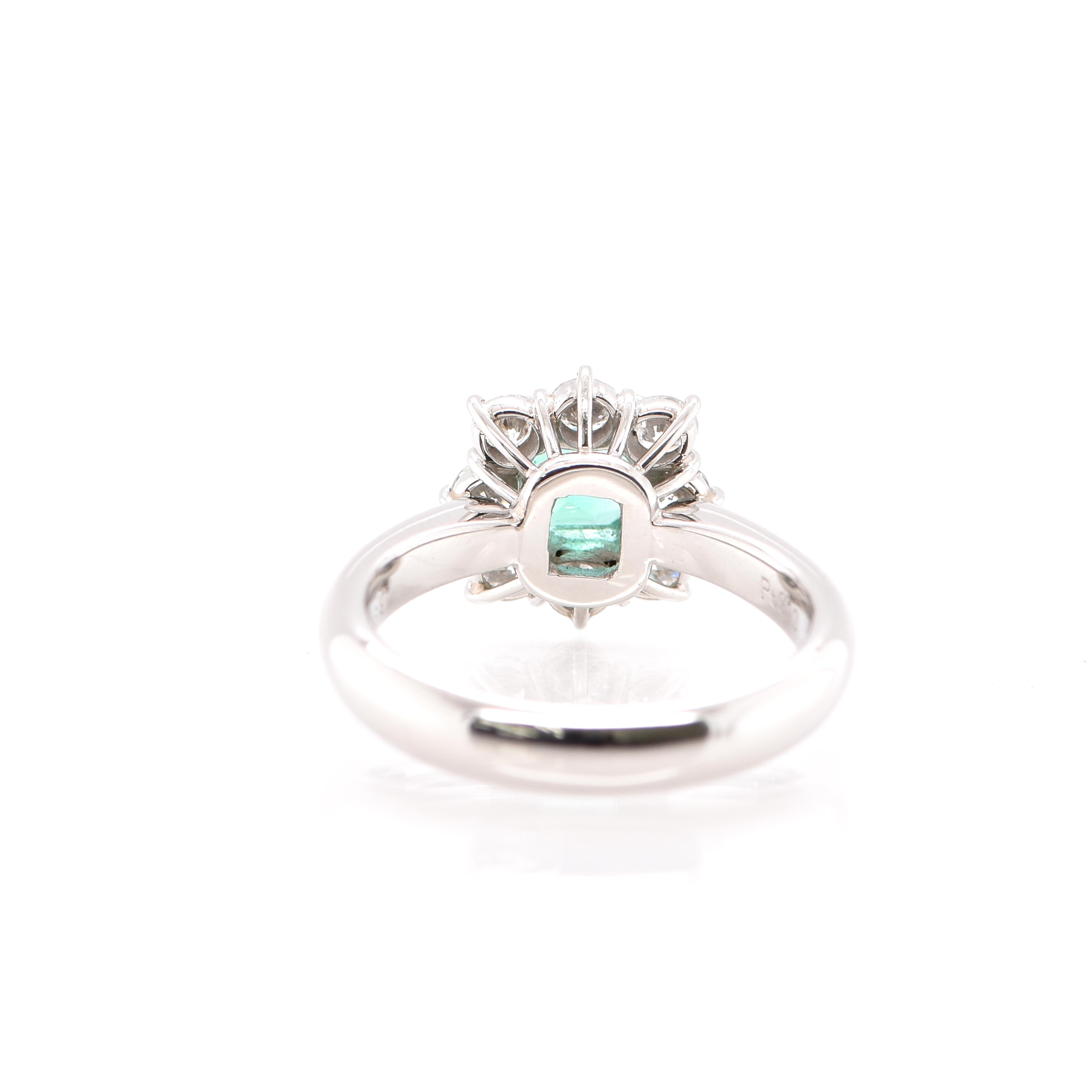 A gorgeous Cluster Ring featuring a GIA Certified 0.61 Carat No Oil Colombian Emerald and 0.69 Carats of Diamond Accents set in Platinum. People have admired emerald’s green for thousands of years. Emeralds have always been associated with the
