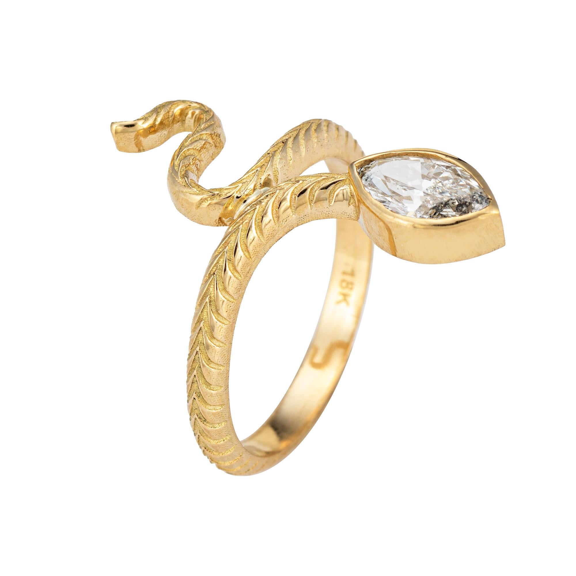 Stylish diamond snake ring crafted in 18 karat yellow gold. 

Marquise brilliant diamond measures 7.98 x 4.42 x 2.93 and weighs 0.63 carats. The diamond is graded J color and I1 clarity. Also included is a GIA report/certificate.    

For centuries