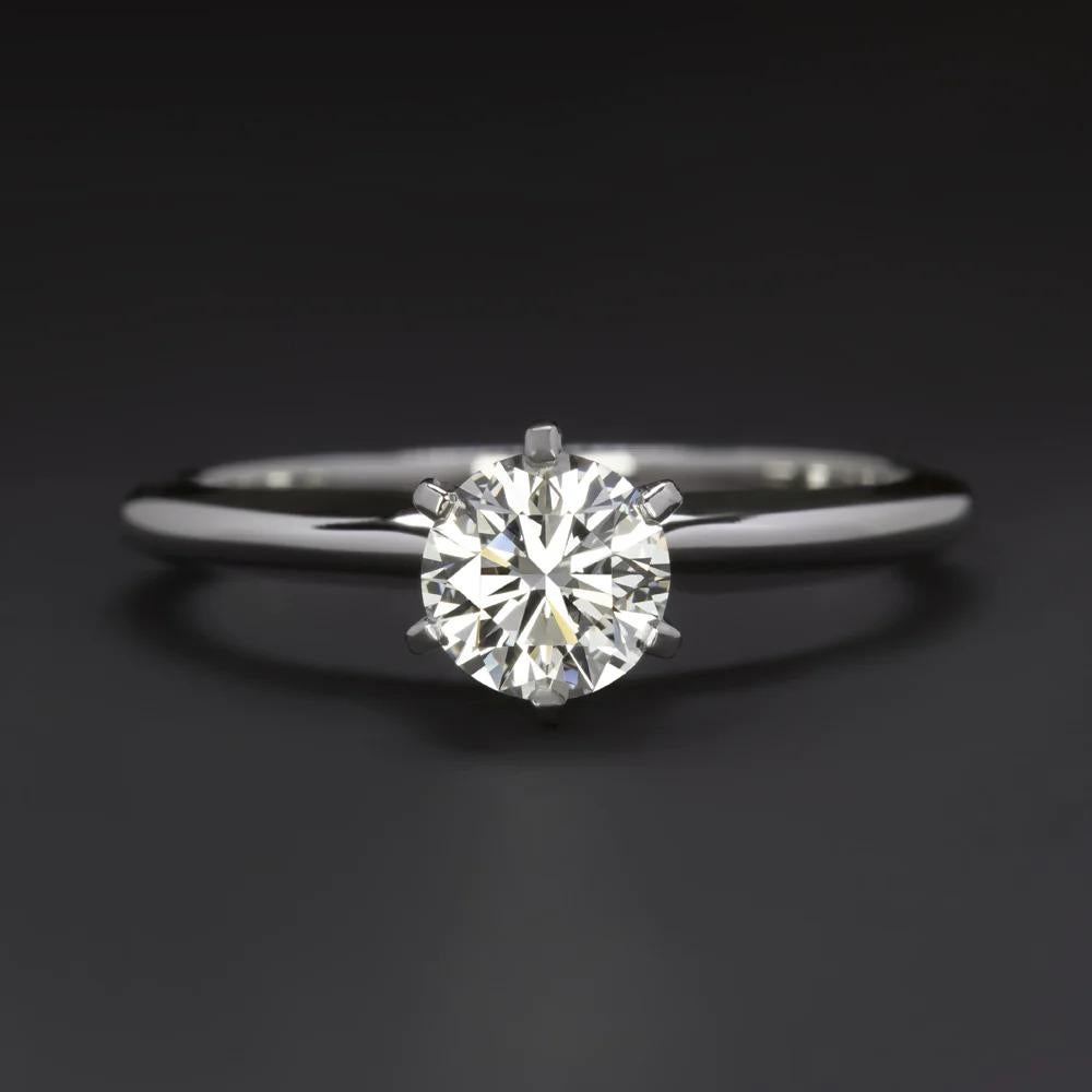 Modern GIA 0.65 Carat Certifed Round Diamond Ring For Sale