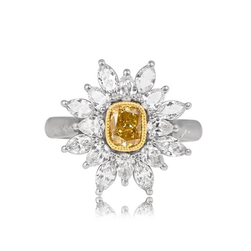 A fancy diamond halo ring featuring a 0.70-carat cushion cut fancy diamond, bezel-set in yellow gold. The center stone is fancy intense orange-yellow and GIA-certified. The fancy diamond is surrounded by a starburst halo of marquise and pear-shaped