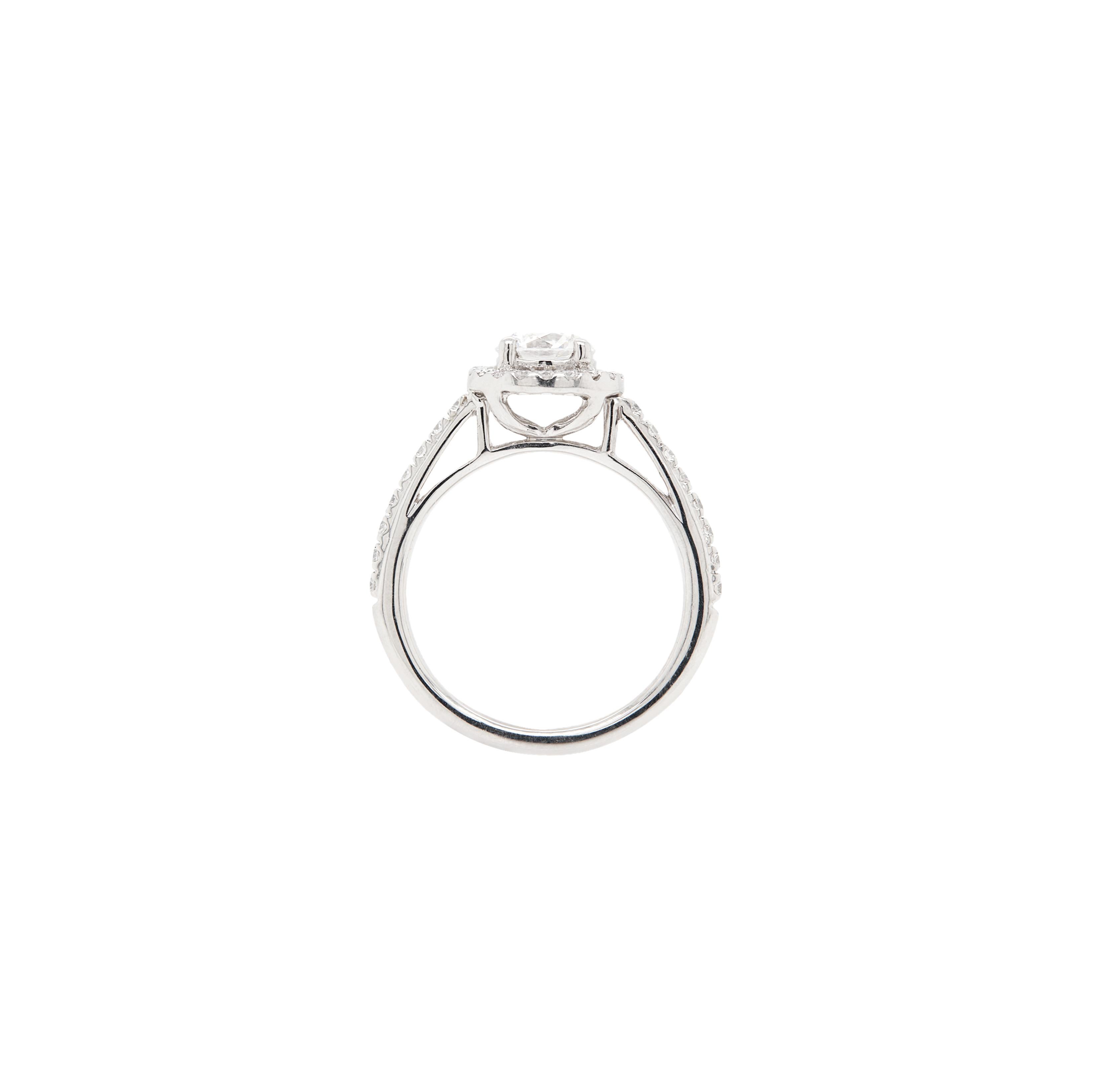 Delicate yet full of character, this piece is definitely the best choice either as an engagement ring or an exquisite addition to a fine jewellery collection.

Sitting to the centre of this wonderful platinum ring is a certified 0.70ct round