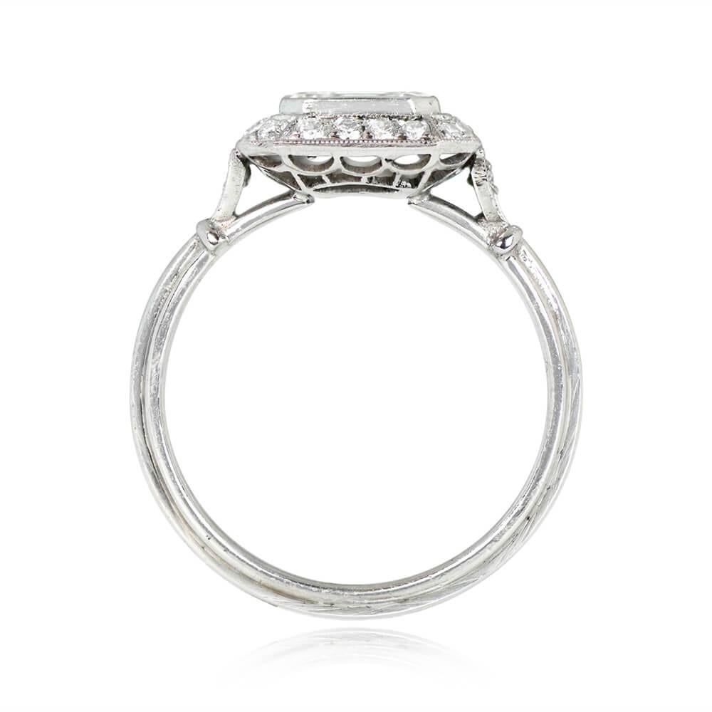 A graceful diamond halo ring highlighting a GIA-certified 0.75-carat emerald cut diamond, J color, and VVS2 clarity. The center diamond is east-west bezel-set and circled by an old mine-cut diamond halo. Further diamonds grace the tapered shoulders,