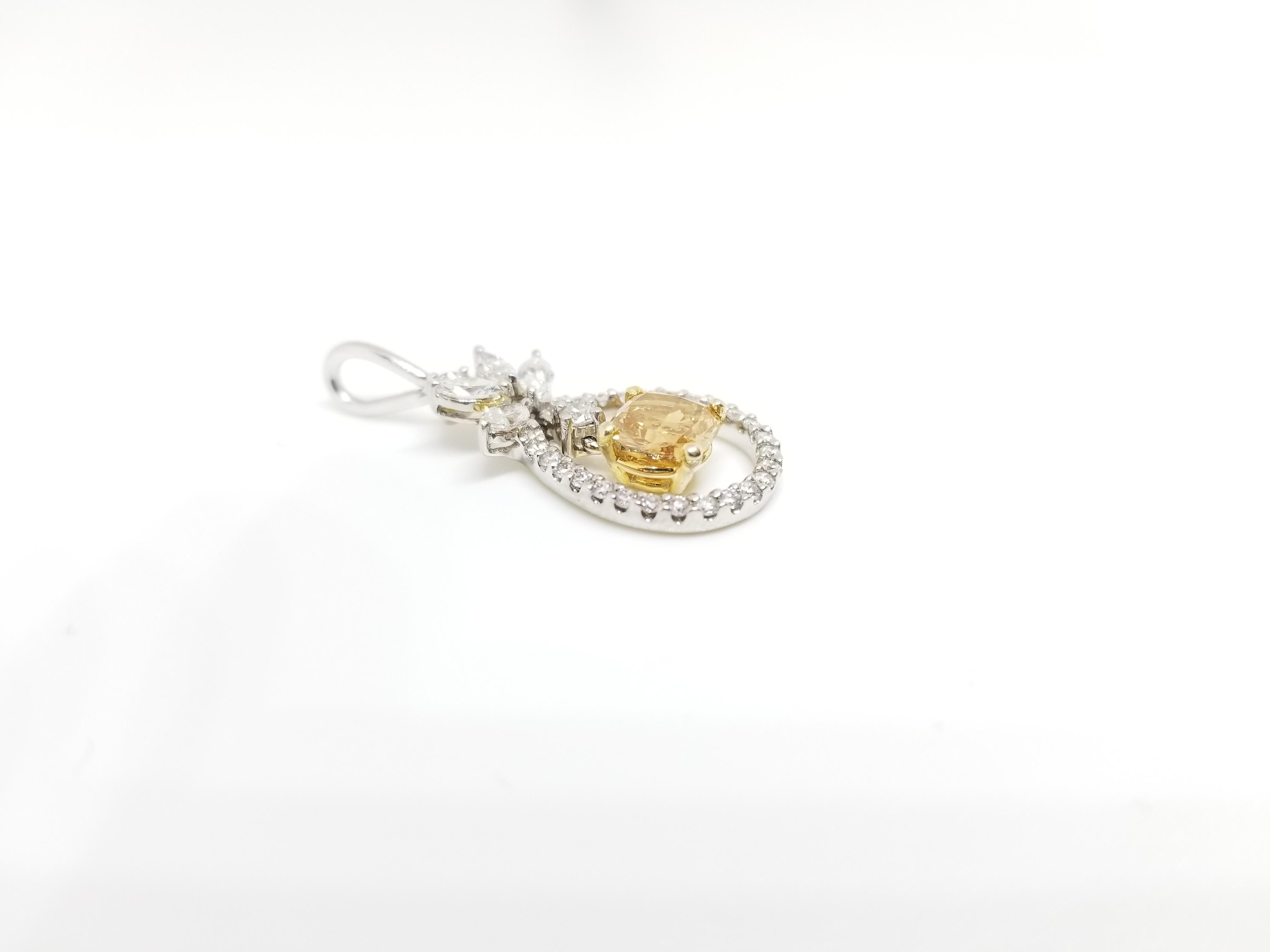 Gorgeous fancy deep orange-yellow color cushion cut diamond pendant, unique color combination cushion weighing 0.80ct GIA, surround by mixed white marquise and round brilliant cut diamonds. set in 14k white gold. pendant measures approximately 1
