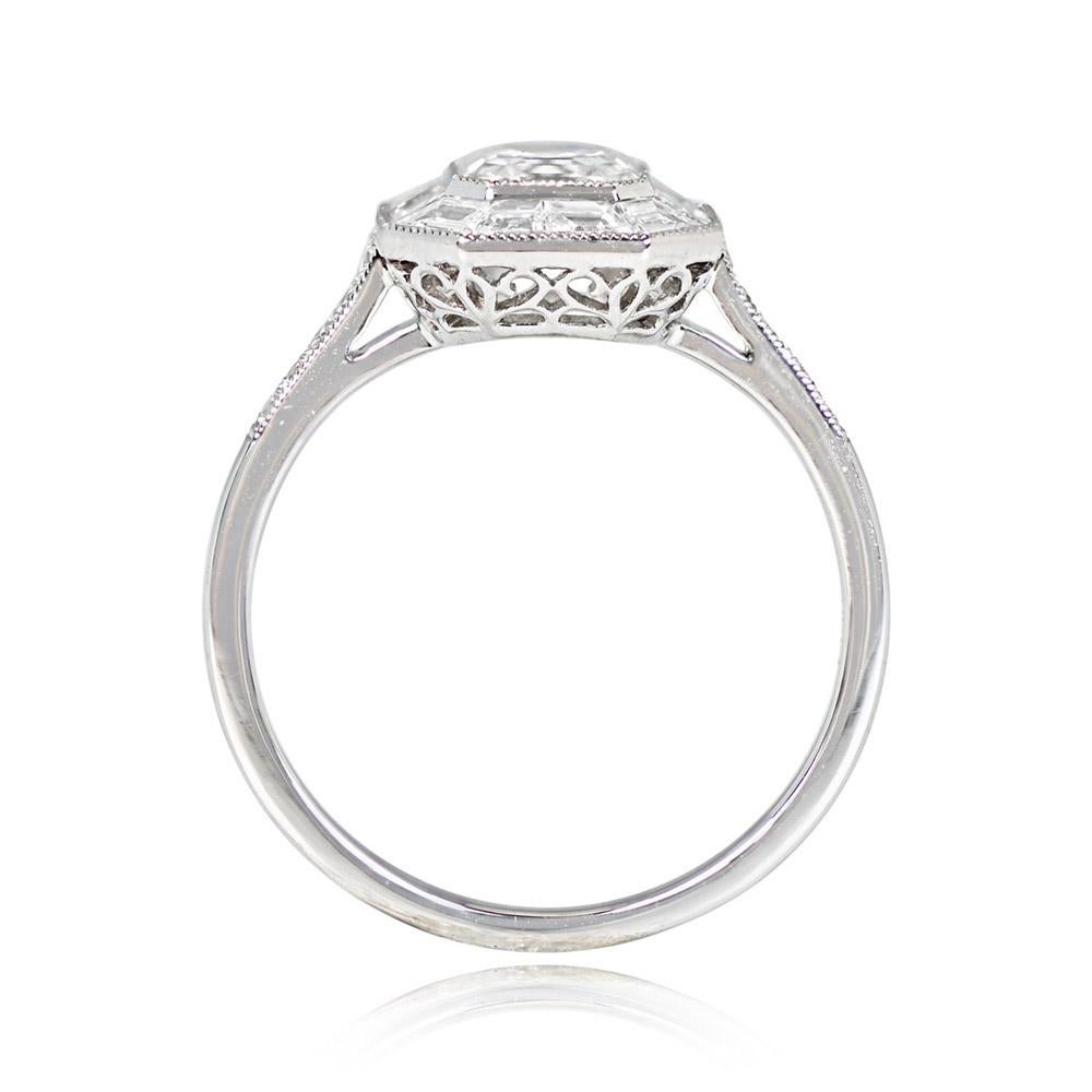 A captivating ring with a bezel-set Asscher cut diamond, encircled by a halo of baguette-cut diamonds. The GIA-certified center stone weighs 0.84 carats, showcasing F color and SI1 clarity. Round brilliant-cut diamonds adorn the shoulders, while an