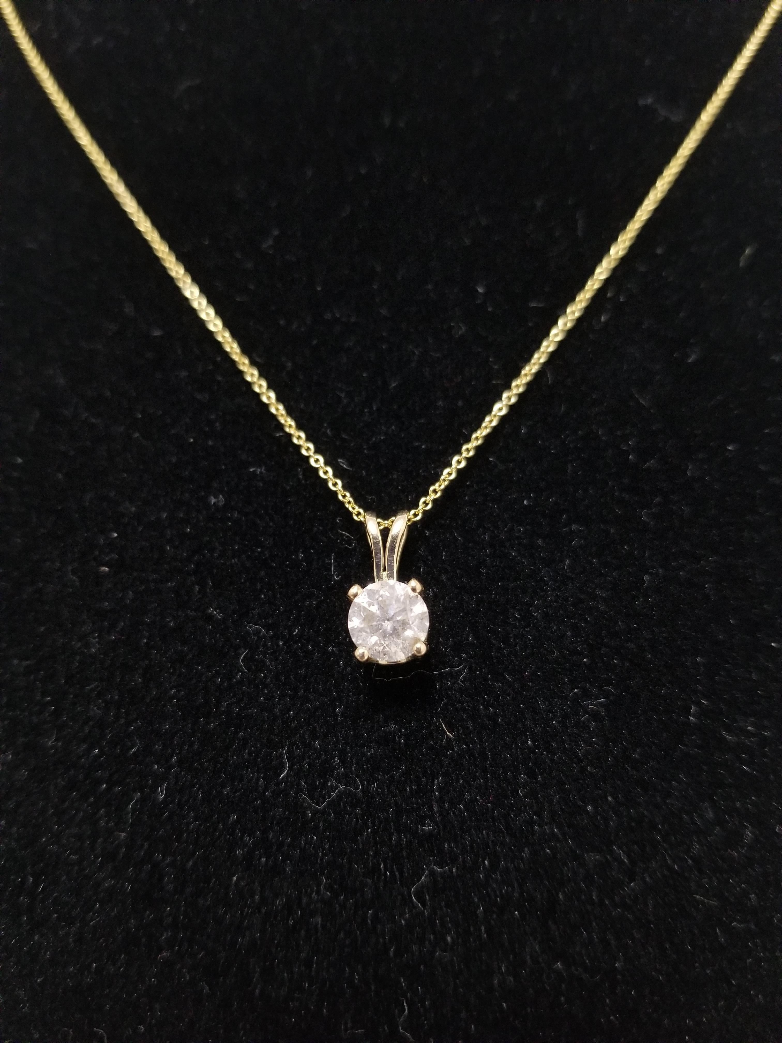 0.84 ct GIA fancy light gray round brilliant cut diamonds. set in 14k rose gold. pendant measures approximately 0.5 inch length and 0.25 inch wide.

(Pendant Only-Chain sold separately.)