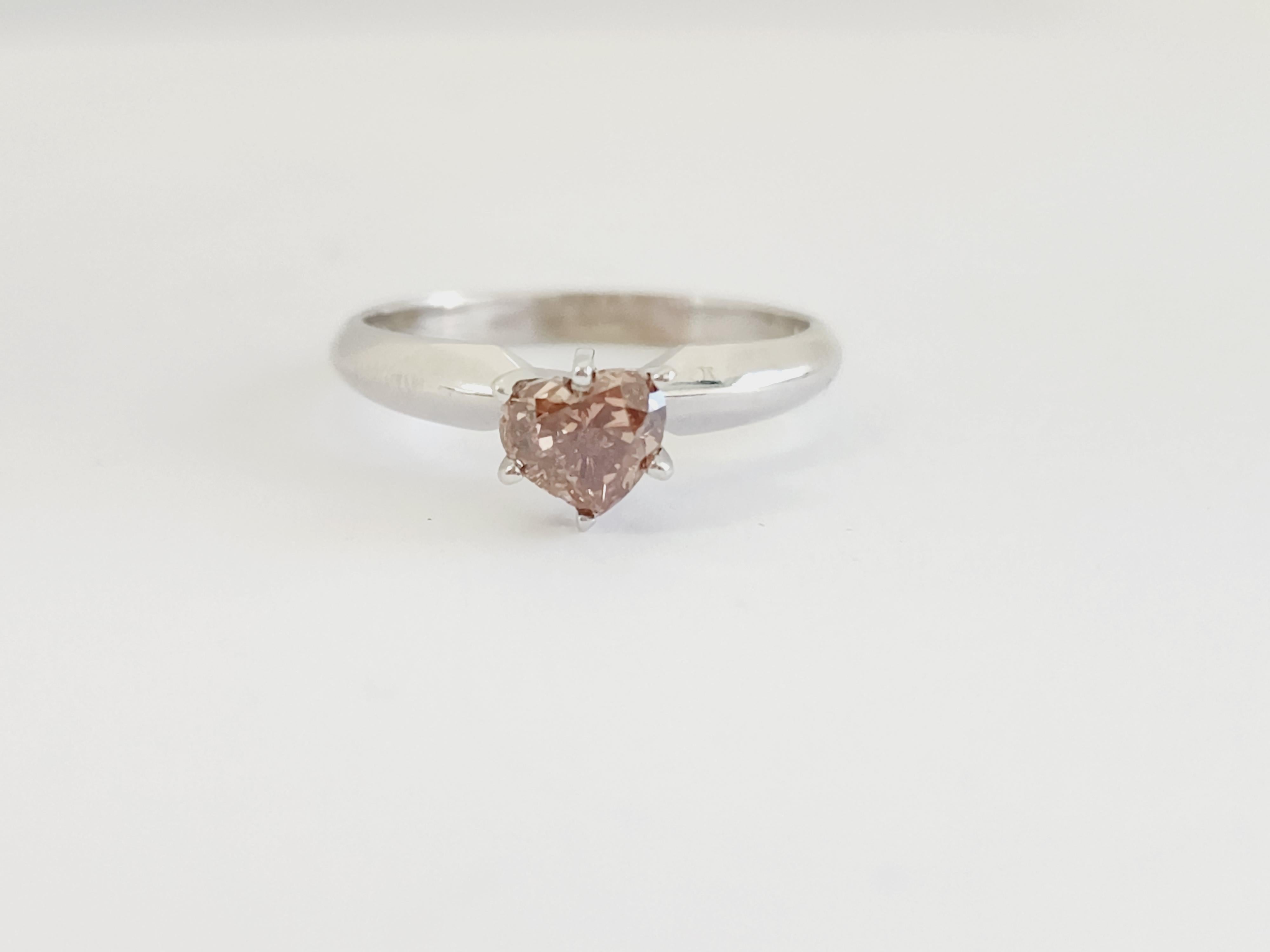 Natural fancy dark pink brown heart shape diamond weighing 0.86 carats. White gold 14k, 
Ring Size 7