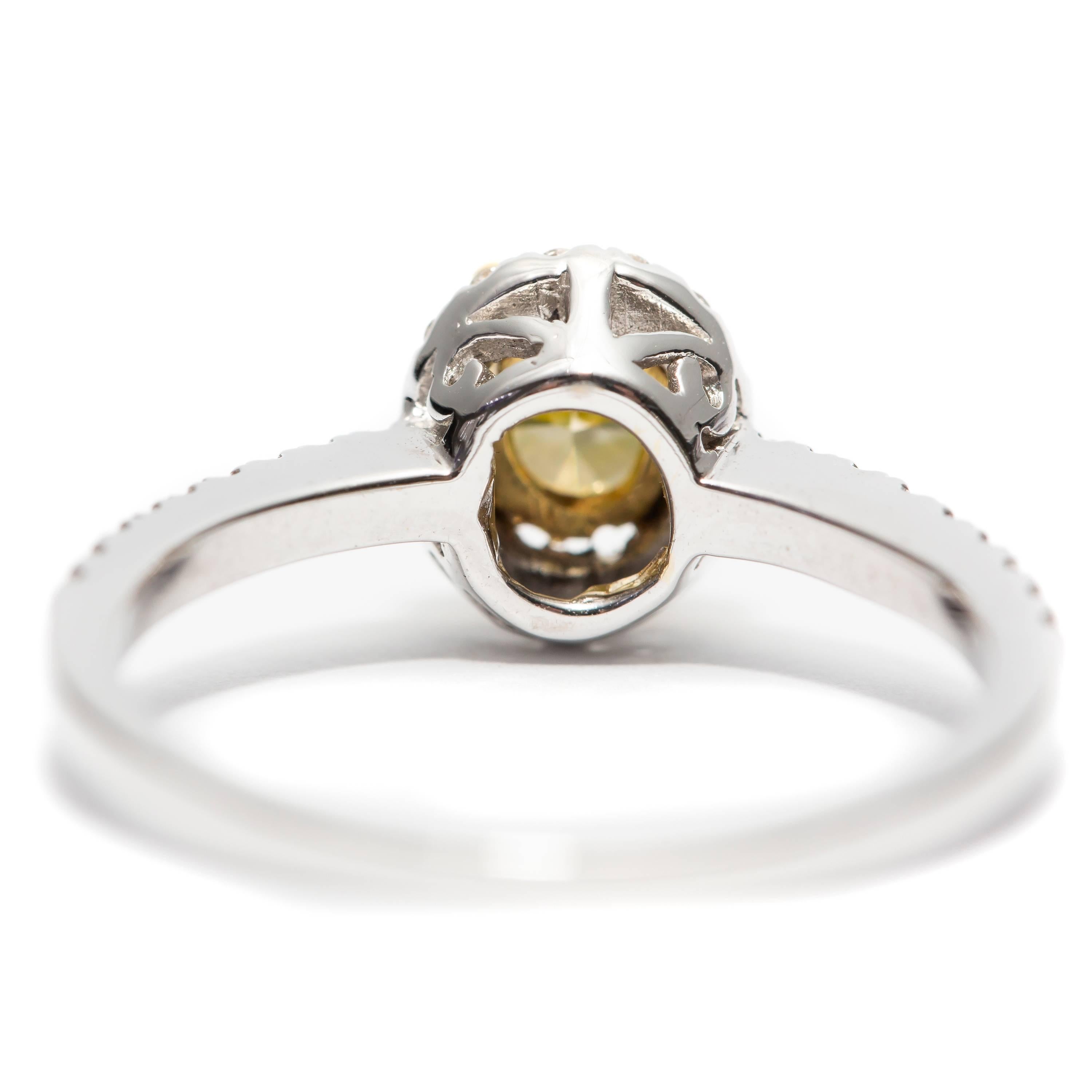 Cushion Cut GIA 0.87 Carat Yellow Cushion Diamond 18 Karat White Gold Halo Engagement Ring For Sale