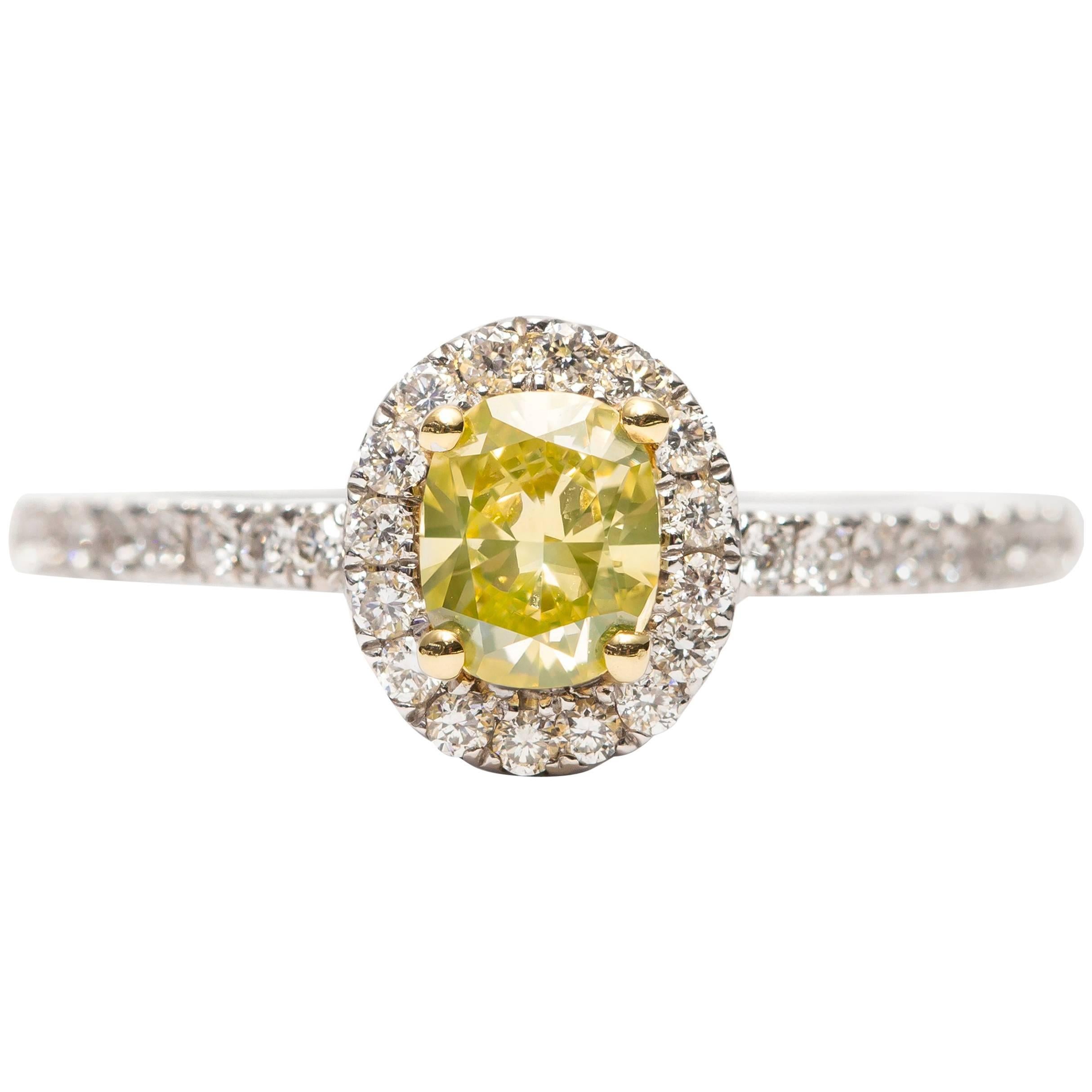 GIA 0.87 Carat Yellow Cushion Diamond 18 Karat White Gold Halo Engagement Ring For Sale