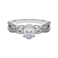 GIA 0,9ct Anello di diamanti ovale a tre pietre con gambo diviso e pavé in oro bianco 18 carati