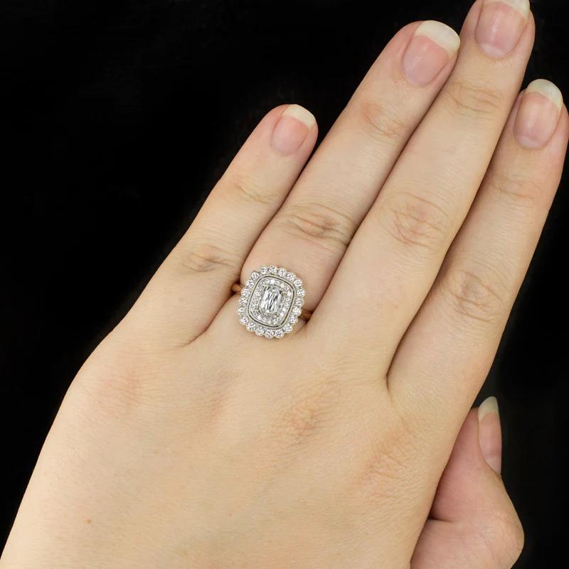 stunning diamond ring features a gorgeous 1 carat diamond with a unique cut set in an eye catching double halo design. The rare and high quality 1.01ct GIA certified diamond has beautifully white color, exceptional VVS1 clarity, and a unique and