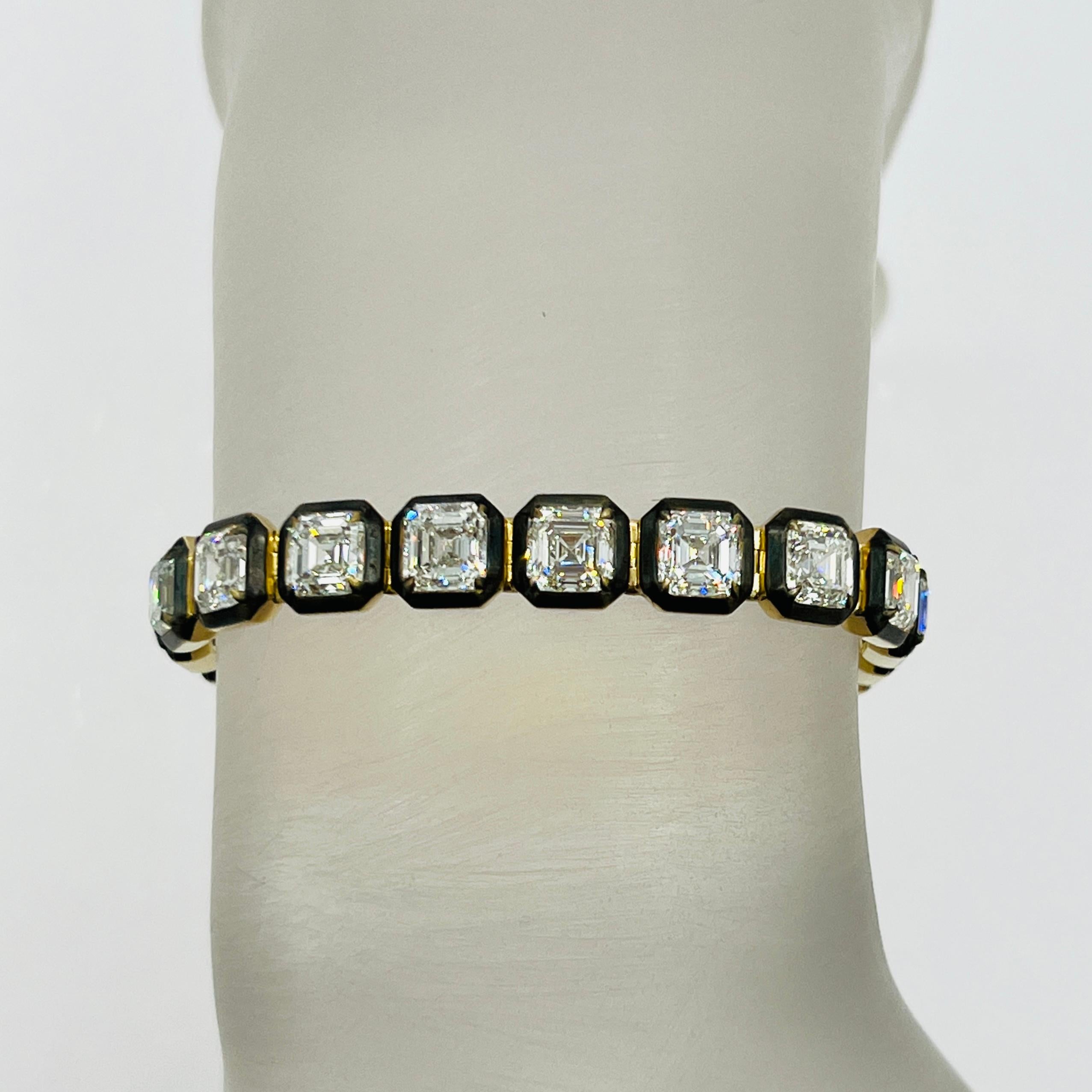 beautiful 21.30 ct. HIJ VVS-VS white diamond asscher cuts.  Handmade in 18k yellow gold and black rhodium.  Total of 21 stones, each one is about 1.00 ct.  Length of bracelet is 6.5