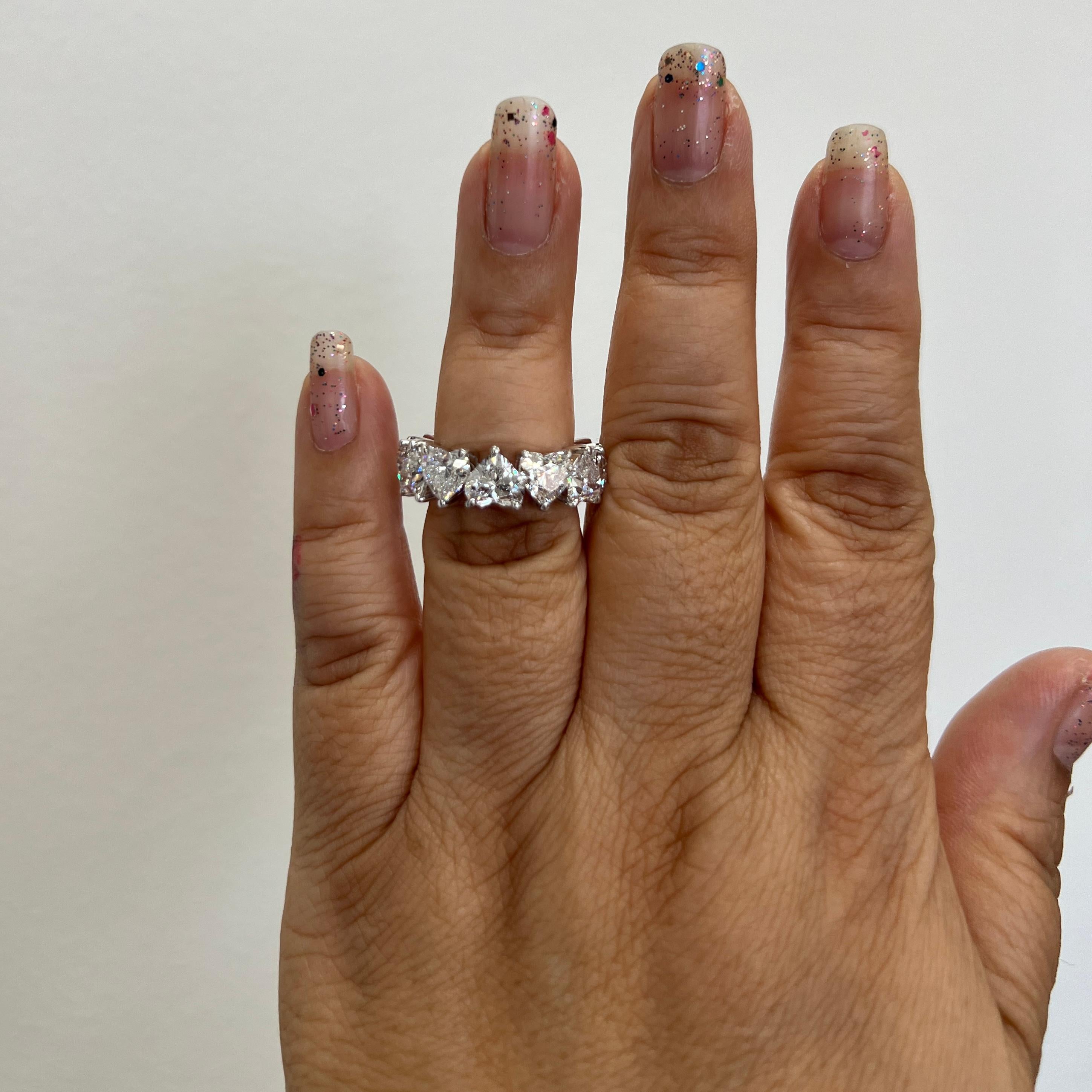 Gorgeous 12.13 ct. DEF SI white diamond heart shapes.  Total of 12 stones, each one is 1.00 carat.  Handmade in 18k white gold.  Ring size 7.  Each stone comes with a GIA certificate.