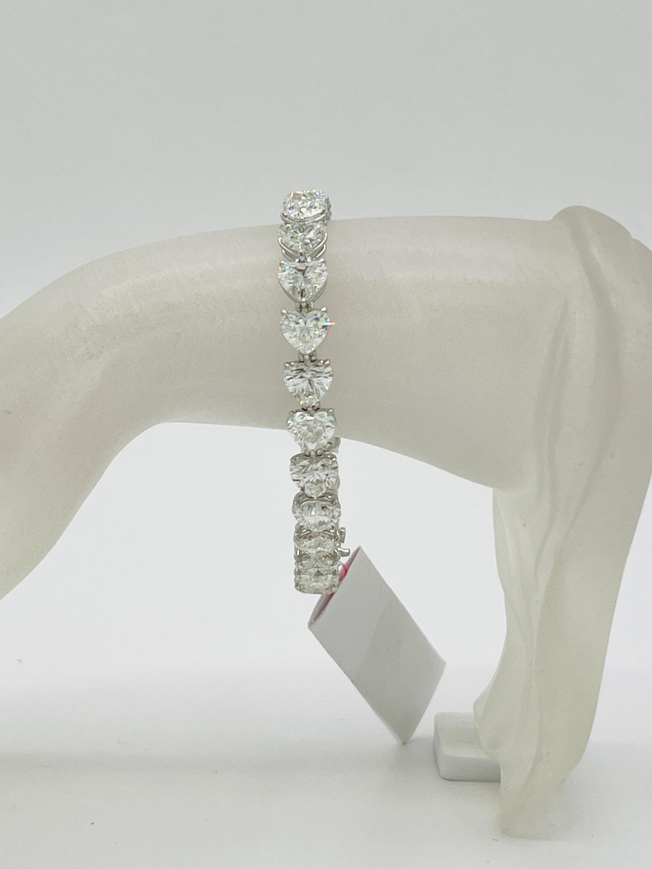 Gorgeous 26.12 ct. EFG VVS-SI white diamond heart shapes.  Total of 26 stones, each one is 1.00 ct.  Handmade in 18k white gold.  Length is 7