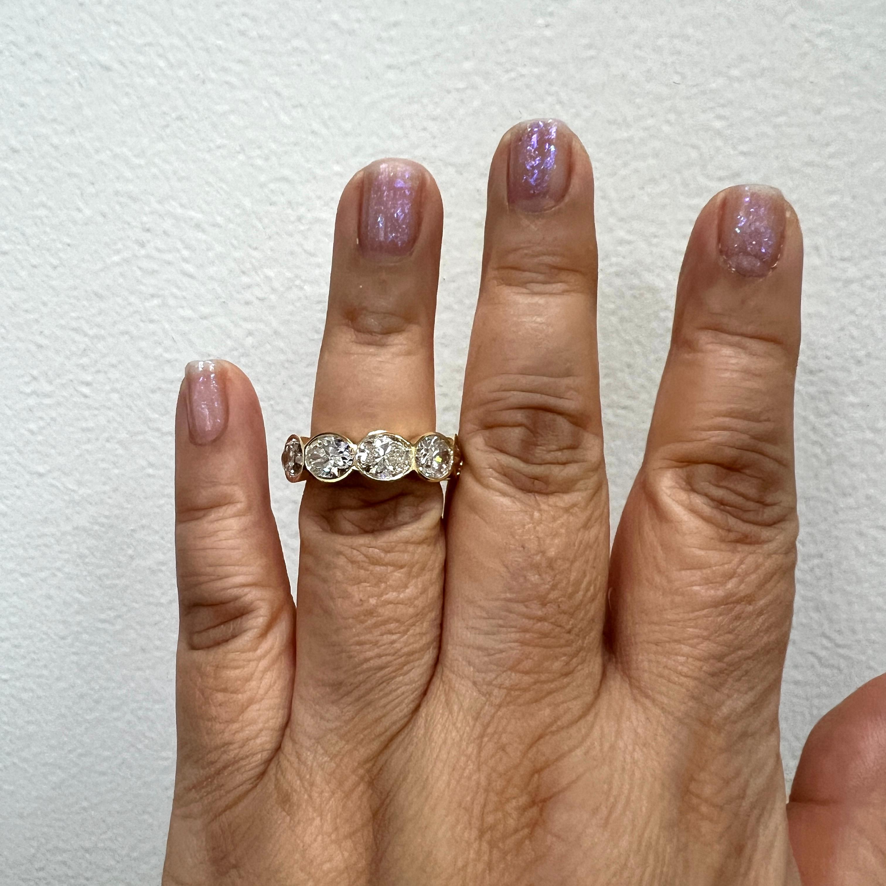 Beautiful 10.01 ct. IJ VS-SI white diamond ovals.  Total of 10 stones, each one is 1.00 ct.  Handmade in 18k yellow gold.  GIA certificates included.  Ring size 7.