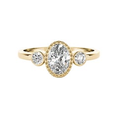 GIA Bague à trois pierres en or jaune 18 carats avec chaton texturé et ovale de 1 carat