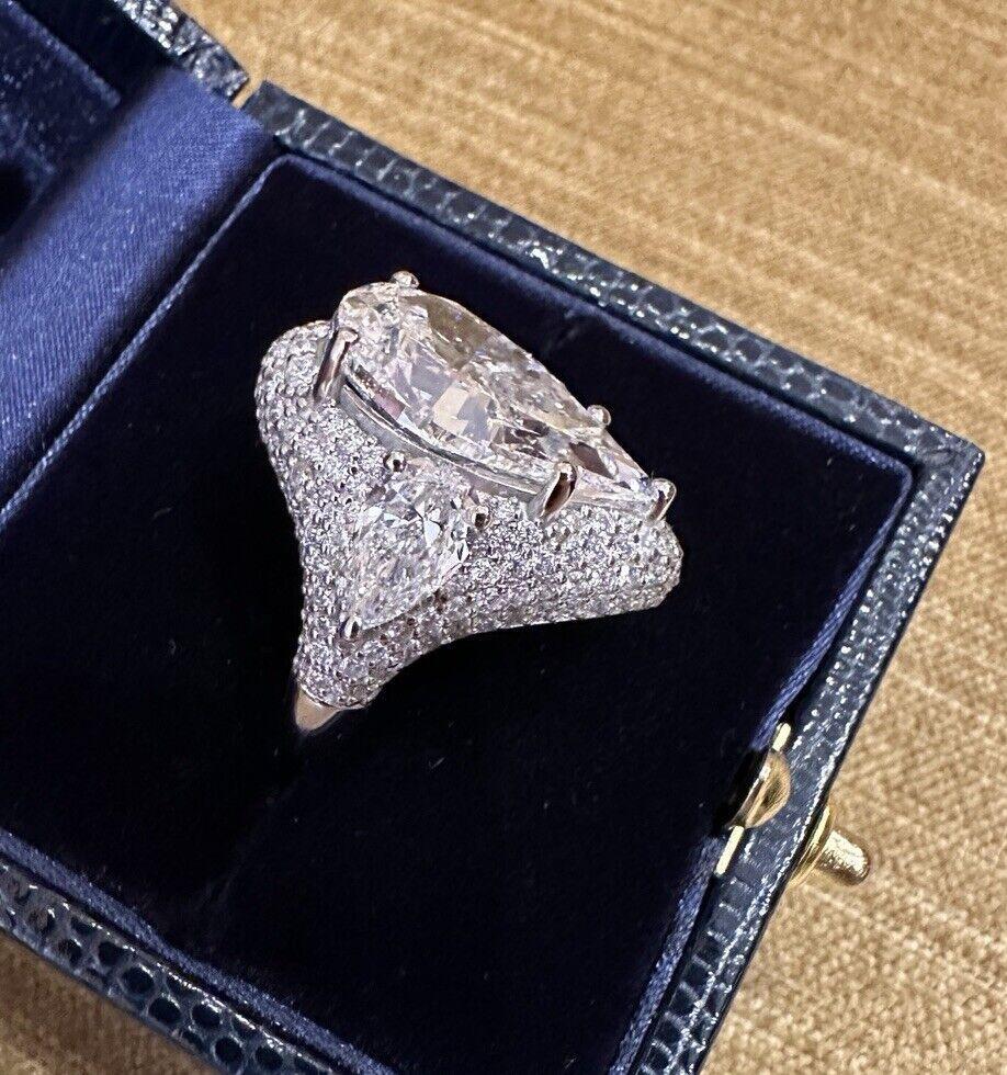 GIA Certified 10.01 carat Pear Diamond Ring in 18k White Gold
              
Custom-made Pear Shaped Diamond Ring features 3 GIA certified Diamonds, including a 10.01 carat Pear Modified Brilliant Diamond and two 1.00 carat Pear Brilliant Diamonds,