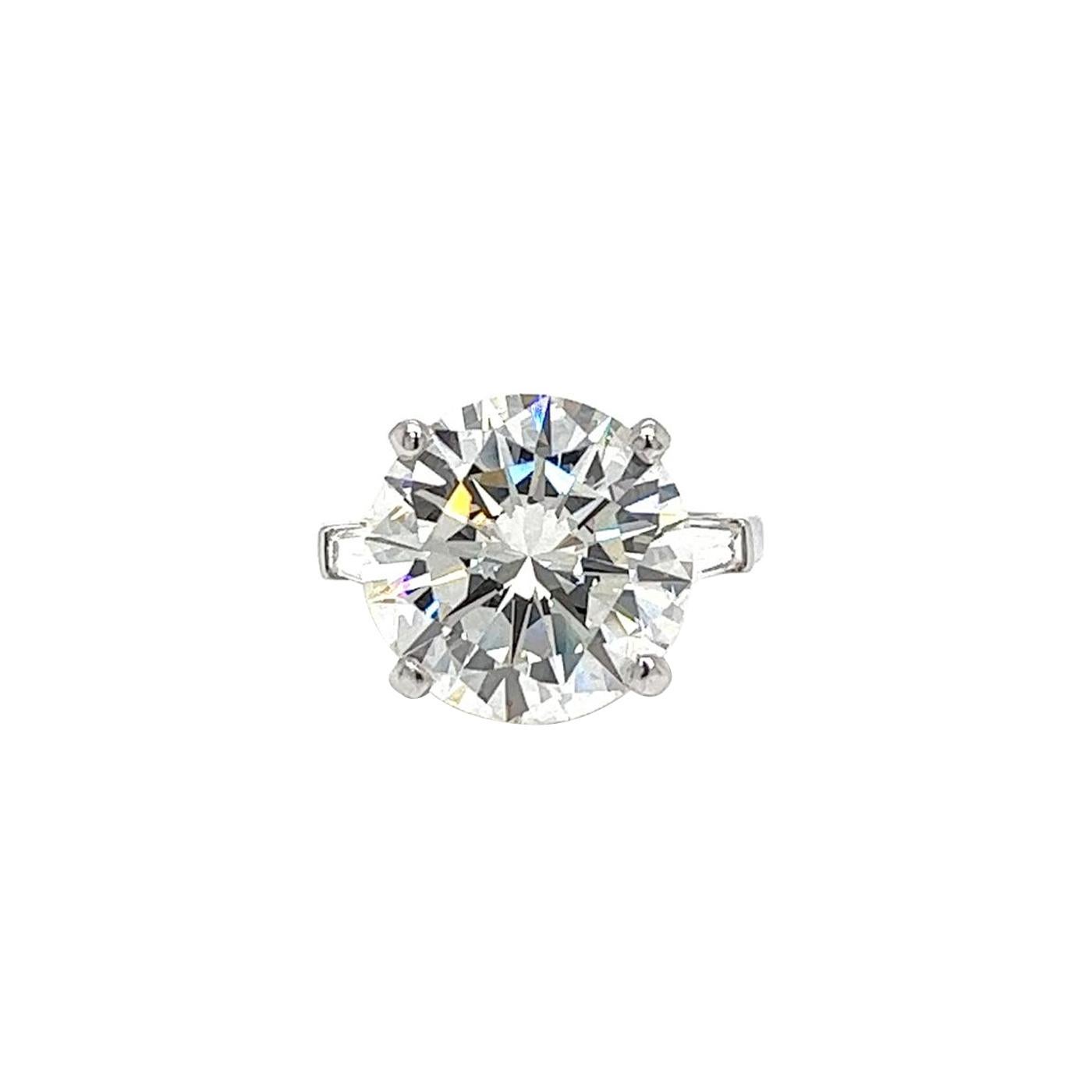 A breathtakingly beautiful diamond ring featuring an eye-clean diamond that radiates with exceptional clarity. The diamond is impressive and features a round brilliant-cut natural diamond with a weight of 10.01 carats. boasting a J color and VS2