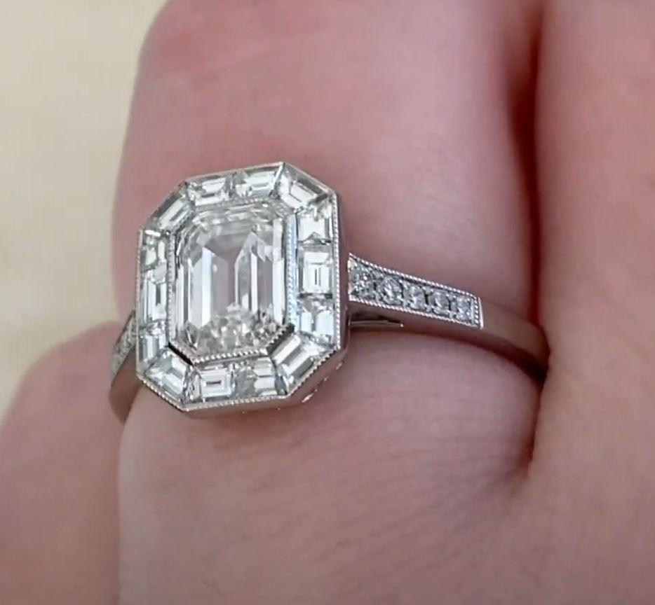 This exquisite engagement ring showcases a stunning emerald-cut diamond, GIA-certified at approx. 1-carat with an I color grade and VS2 clarity. The elegant step-cut facets of the emerald diamond create a mesmerizing play of light, exuding timeless