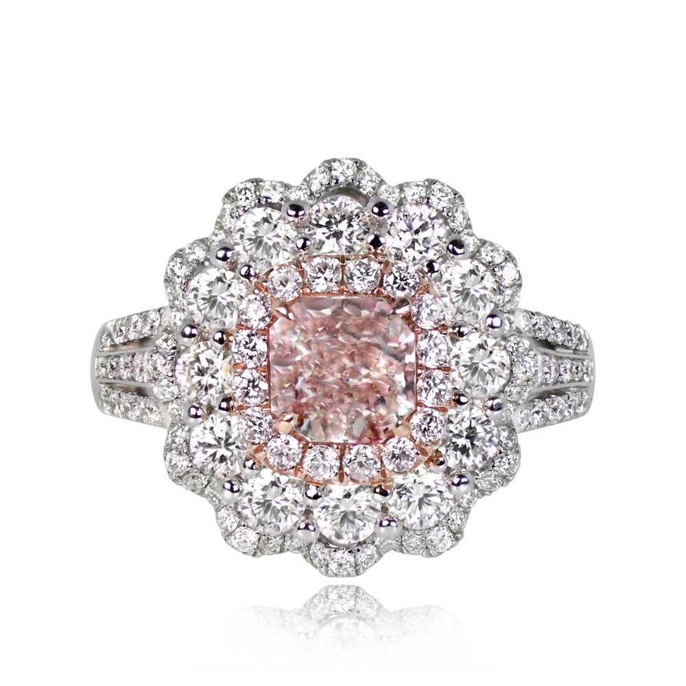 This exquisite ring features a radiant-cut GIA-certified Fancy Pink diamond at its center, weighing 1.00 carat with VVS2 clarity. The central gem is elegantly held by rose gold prongs and encircled by a halo of additional pink diamonds, totaling