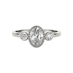 GIA 1.01 Carat Oval Textured Bezel Three-Stone 18K White Gold Diamond Ring