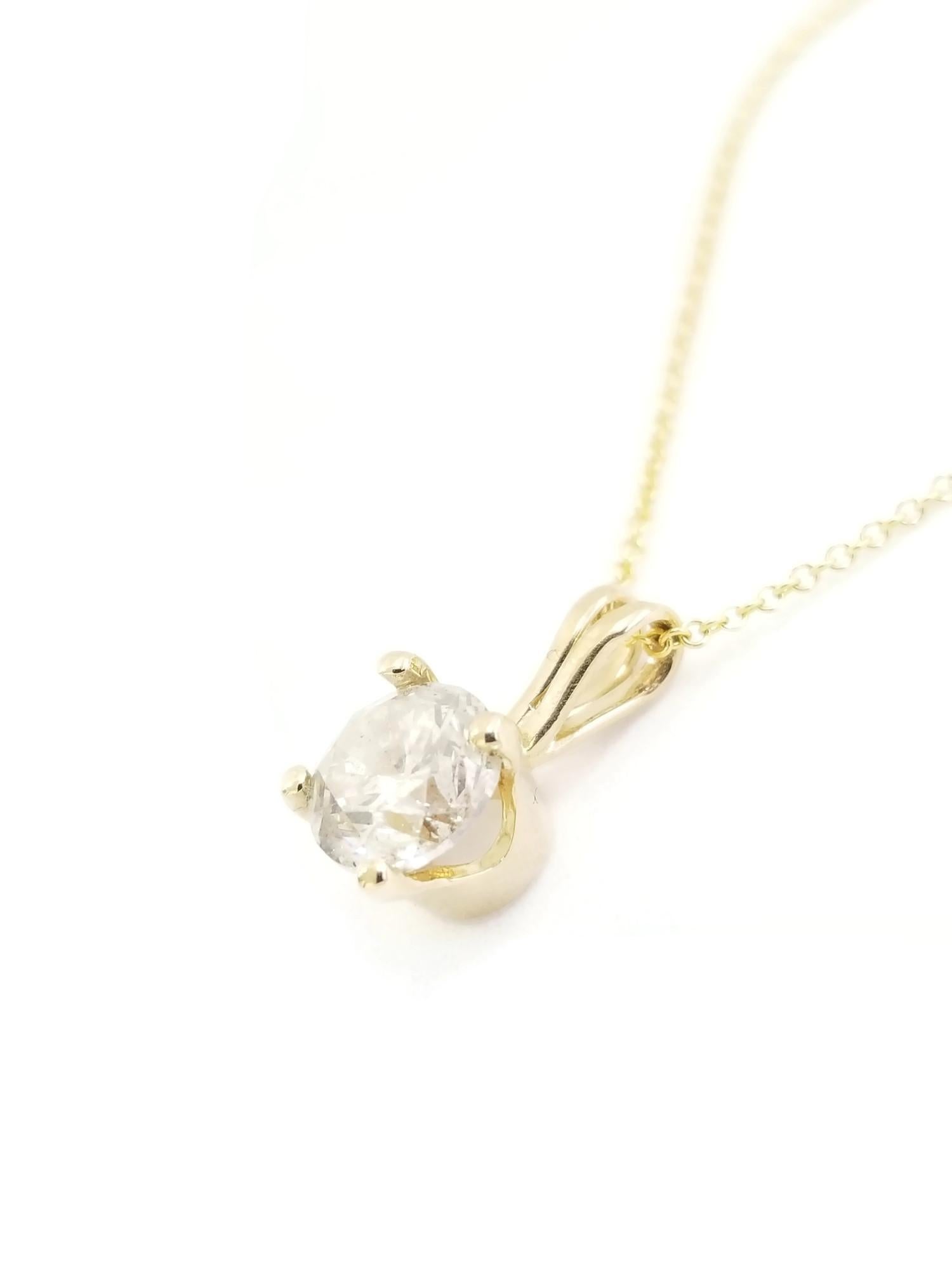 Gorgeous diamond pendant, 1.01 ct GIA round natural faint gray brilliant cut diamonds. set in 14k gold. pendant measures approximately 0.5 inch length and 0.25 inch wide. 

(Pendant Only-Chain sold separately.)