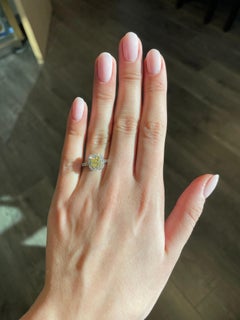 GIA 1.01ct Cushion Fancy Yellow Diamond with Diamond Halo Ring 18k White Gold