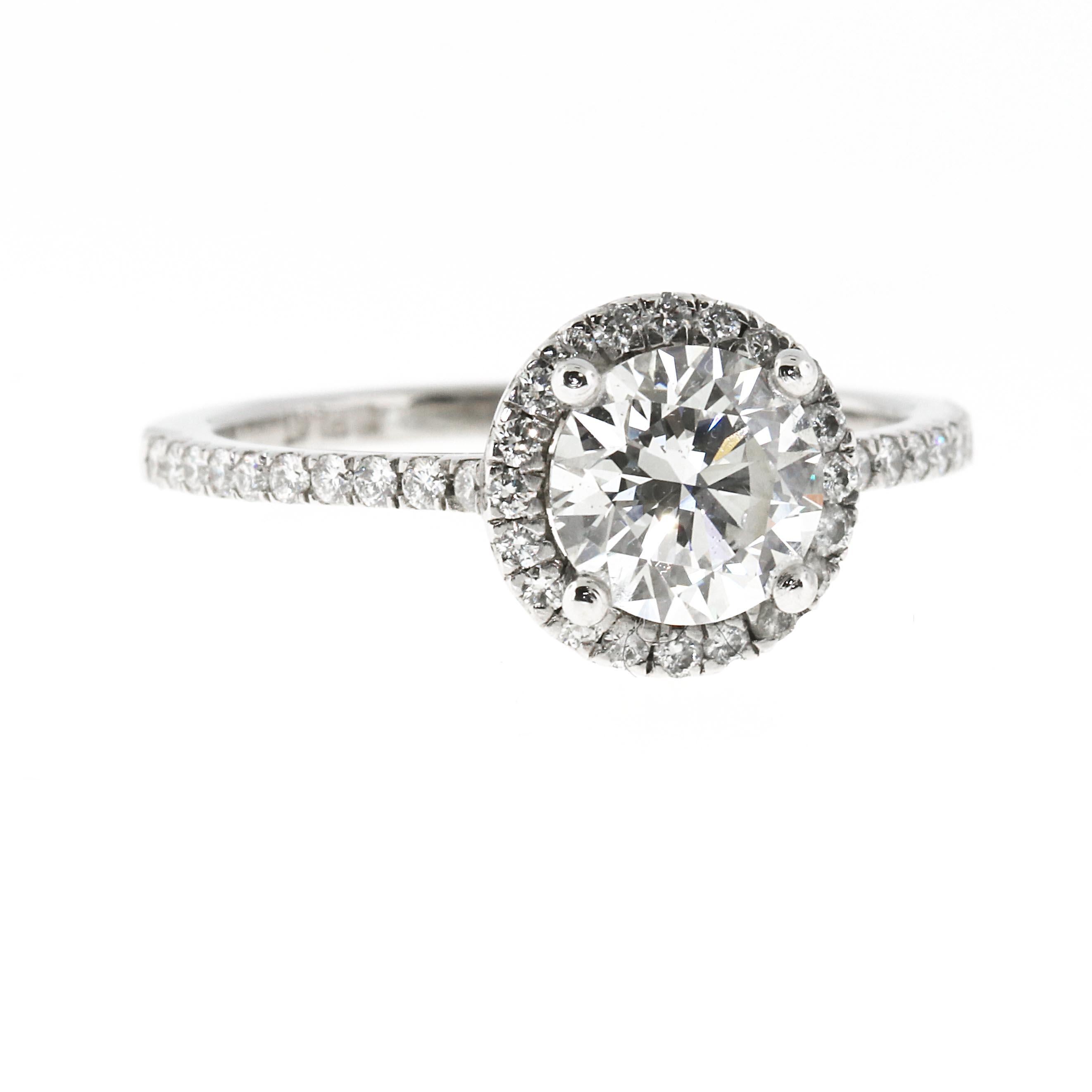A spectacular 1.02 E-VS2 Round diamond engagement ring. This diamond has all the right proportions. It is triple excellent which means the cut, the polish and the symmetry are all excellent. There is no better looking 1.02 E-VS2 available. The stone