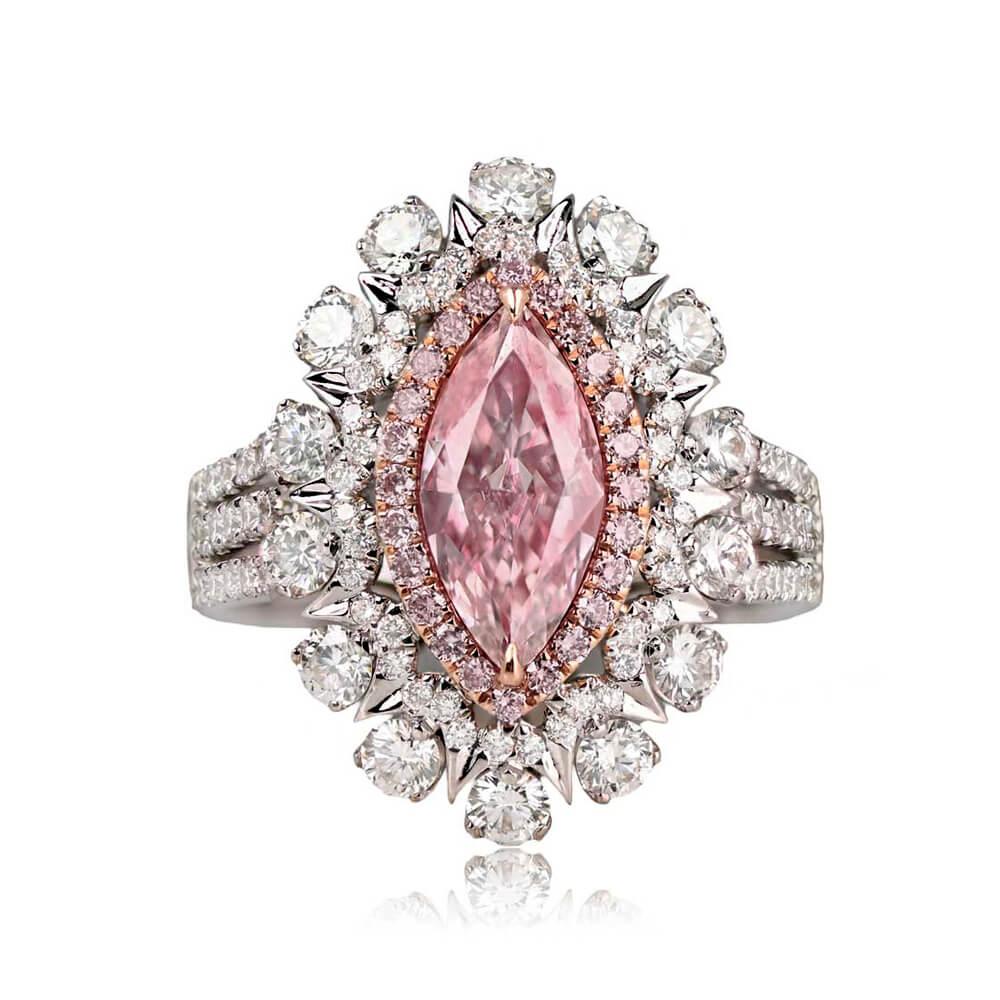A marquise-cut GIA-certified 1.02 carat Fancy Light Pink diamond with VS2 clarity takes center stage in this colored diamond ring. The focal stone is enhanced by a prong-set halo of fancy pink diamonds, encircled by a double halo of round brilliant