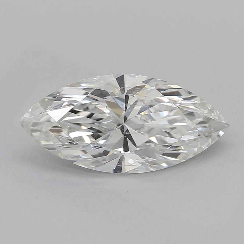 Handcrafted in New York, this stunning diamond ring features a captivating central marquise diamond weighing 1.03 , graded I and SI2 , offering an exquisite balance of brilliance and sparkle. The unique design is enhanced by two smaller diamonds on