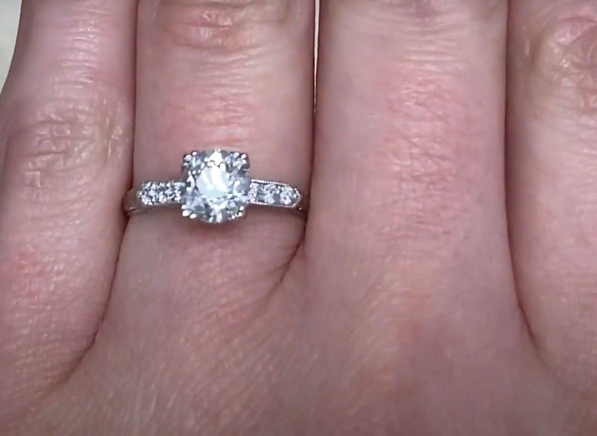 This exquisite platinum engagement ring showcases a breathtaking approx. 1.00-carat old European cut diamond, certified by GIA for its exceptional quality. With a G color grade and SI1 clarity, the center stone radiates timeless brilliance.