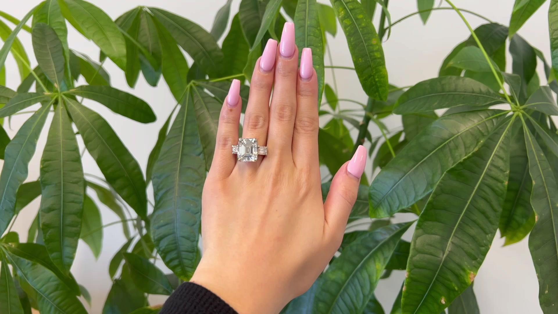 One GIA 10.58 Carats Art Deco Emerald Cut Diamond Platinum Ring. Featuring one GIA antique emerald cut diamond of 10.58 carats, accompanied with GIA #13355929 stating the diamond is I color, VS1 clarity. Accented by two emerald cut diamonds with a
