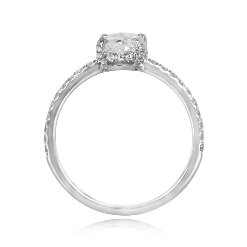 An exquisite diamond solitaire engagement ring showcases a GIA-certified 1.05 carat oval rose cut diamond, boasting G color and VS2 clarity. The diamond graces prongs, complemented by a micro-pave round brilliant cut basket and shoulders. Additional