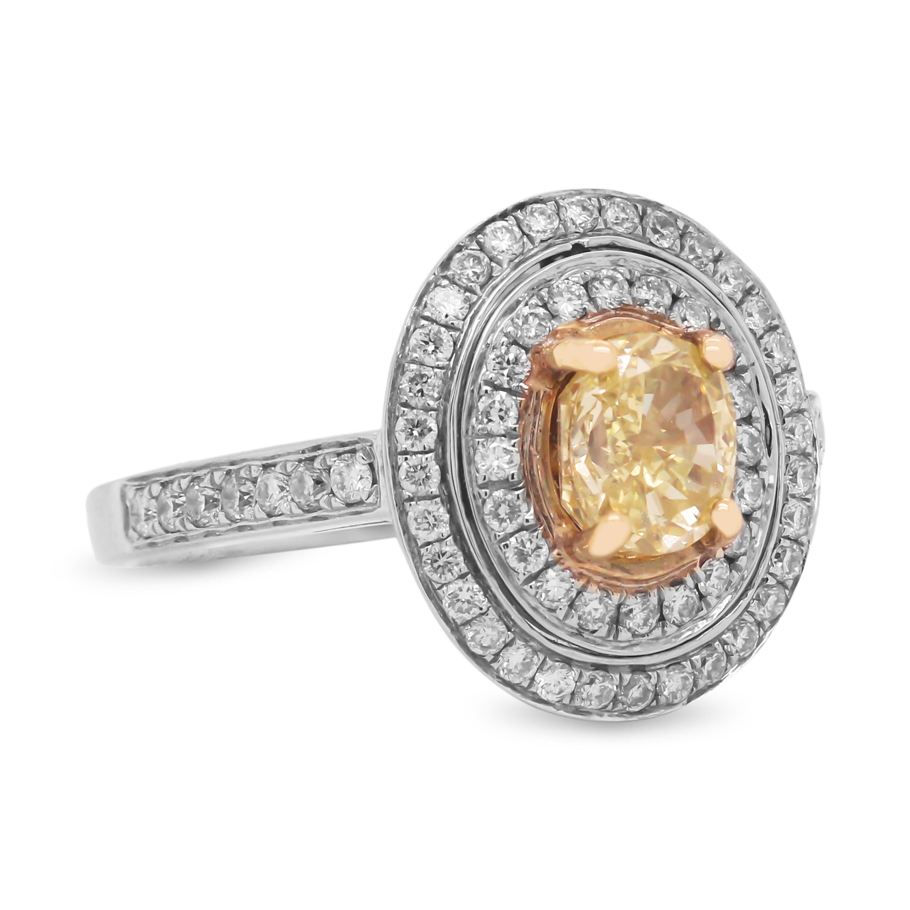 GIA 1.06 Carat VS1 Fancy Intense Yellow Diamond Ring with Diamonds Set in 18K White Gold

This oval Fancy Intense Yellow Diamond is a beautiful everyday ring with its natural beauty. Double halo mounting set with two rows of diamonds along with half