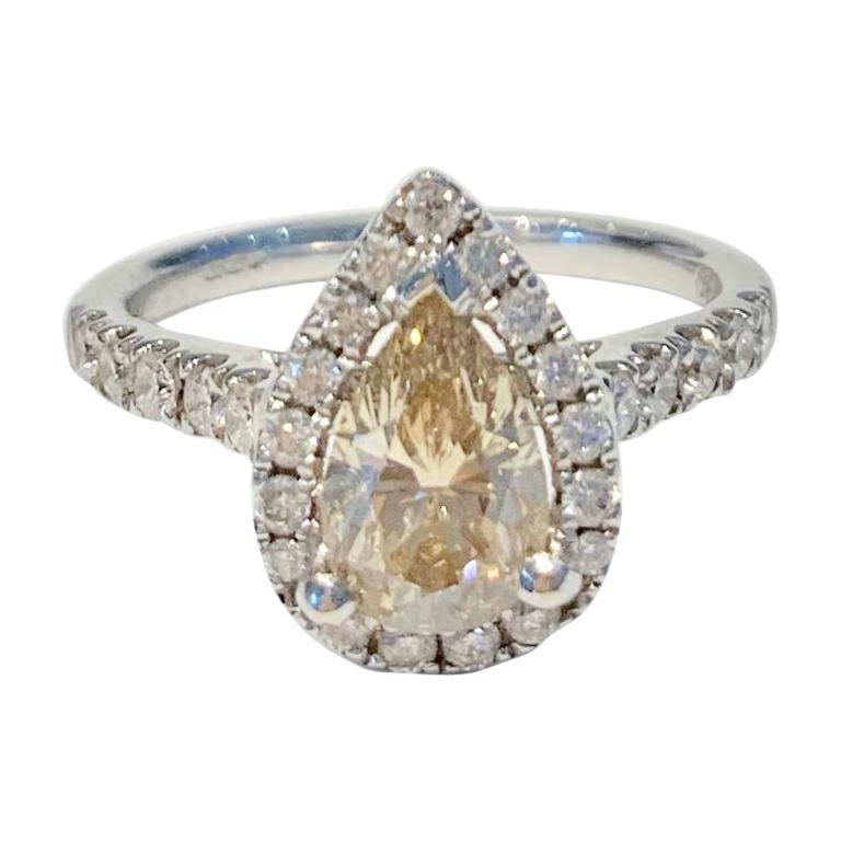 GIA 1.07 Carat Fancy Color Pear Cut Diamond Ring in 18 Carat Gold Halo Setting For Sale