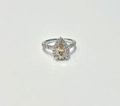 GIA 1.07 Carat Fancy Color Pear Cut Diamond Ring in 18 Carat Gold Halo Setting