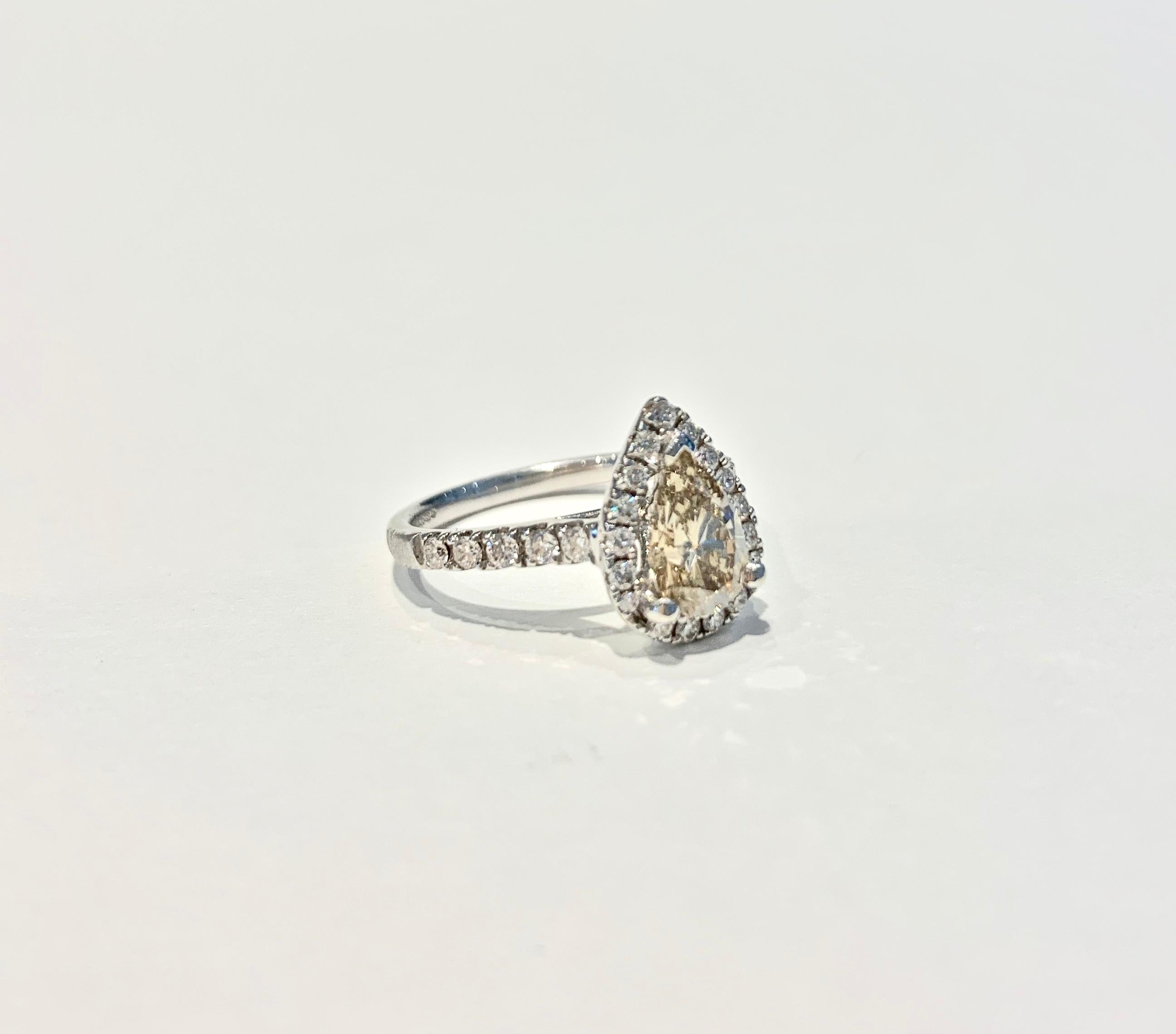 Modern GIA 1.07 Carat Fancy Color Pear Cut Diamond Ring in 18 Carat Gold Halo Setting For Sale