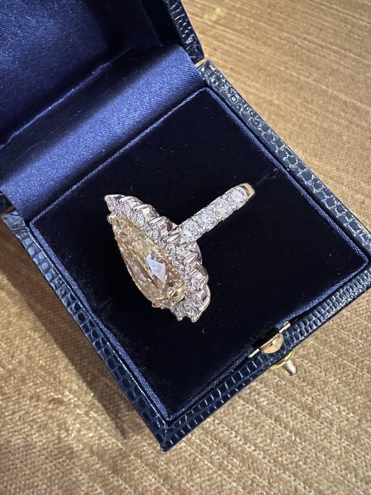 Women's GIA 10.90 carat Fancy Light Yellow Diamond Halo Ring in 18k Gold For Sale