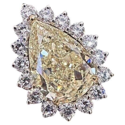 GIA 10.90 carat Fancy Light Yellow Diamond Halo Ring in 18k Gold For Sale