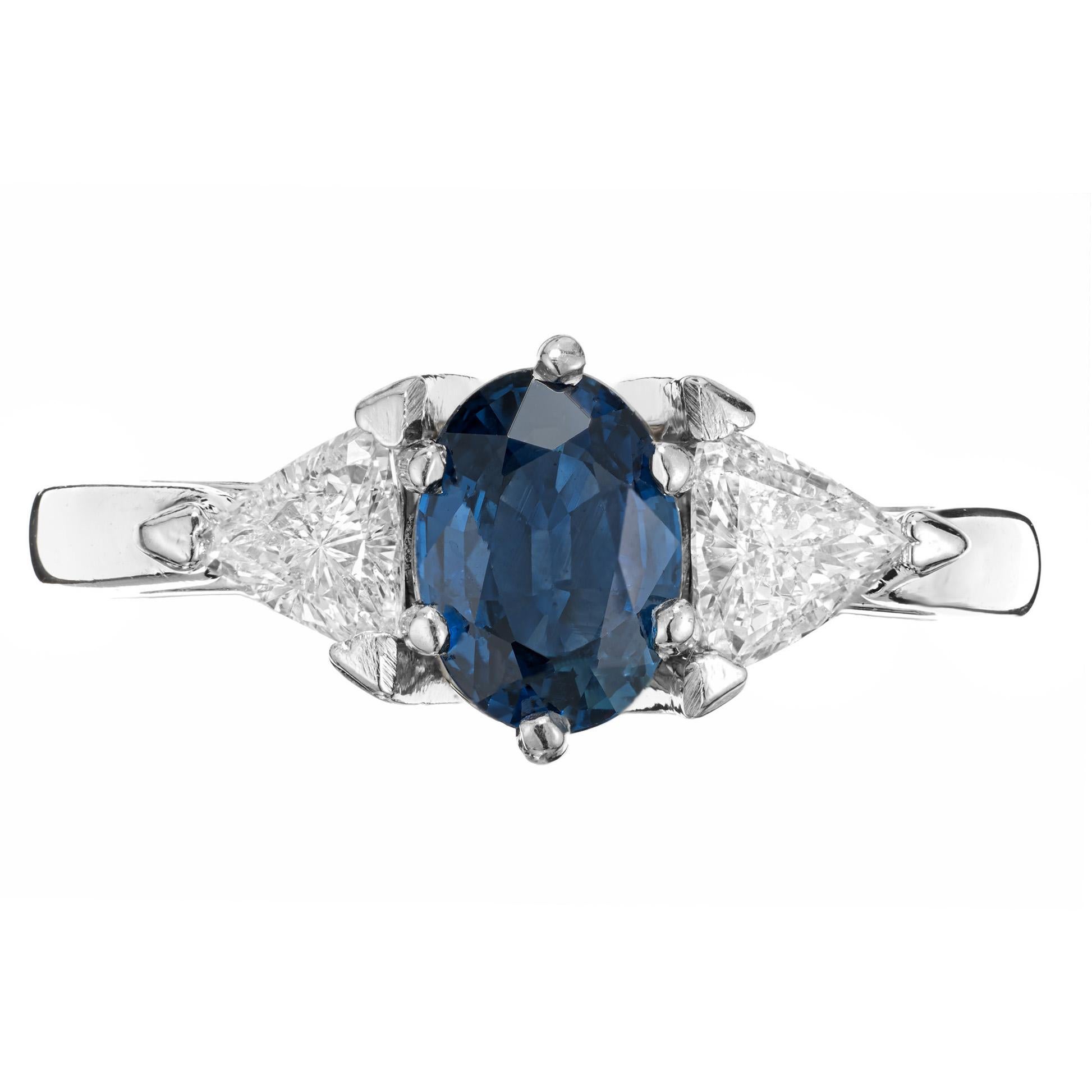 Bright cornflower blue sapphire diamond engagement ring. GIA certified natural no heat Sapphire mounted in a handmade setting with bright sparkly triangular bright white diamond side stones.

1 GIA certified 7.0 x 5.50mm natural bright blue no heat