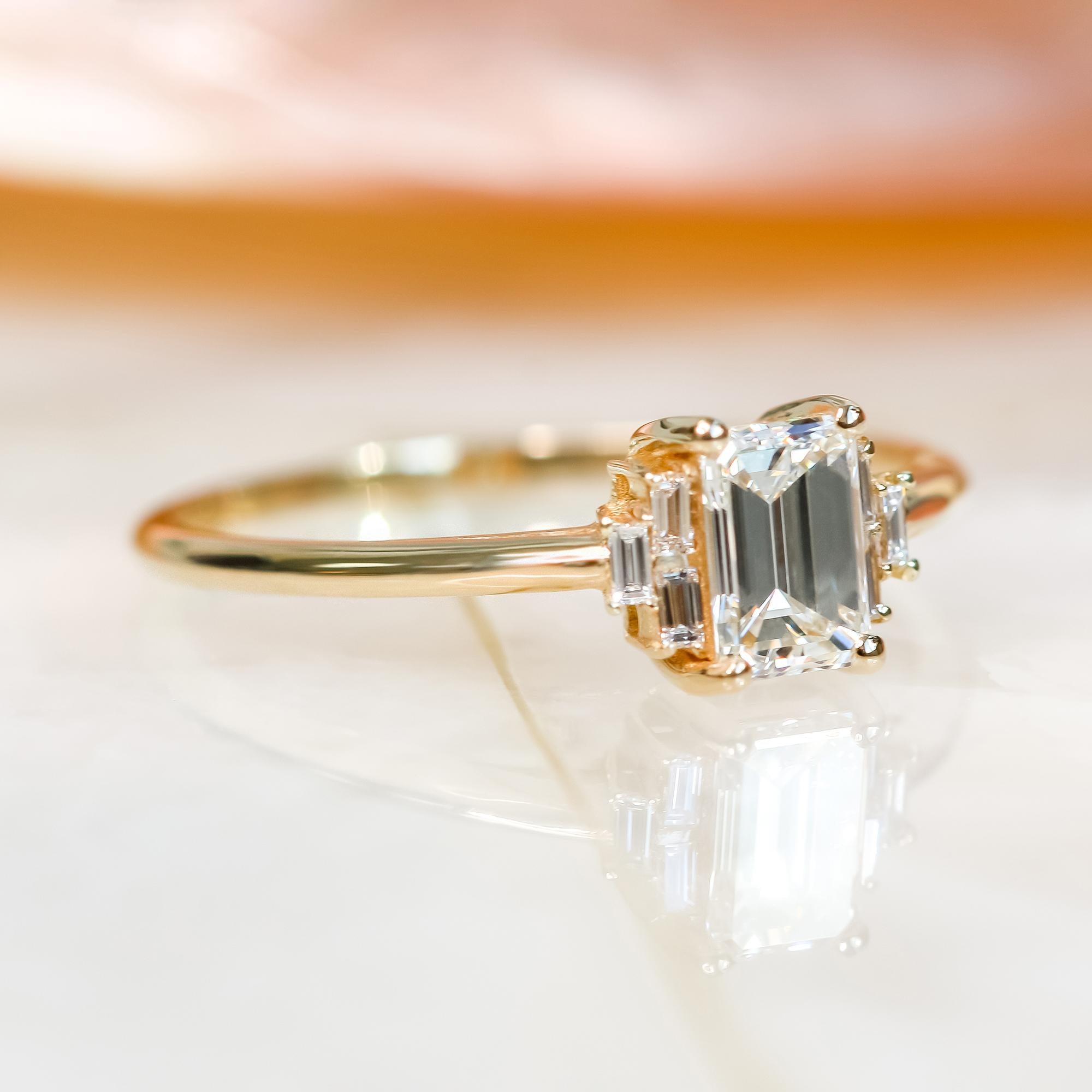 GIA 1.11 Cts Natural Emerald Cut Art-Deco Diamond Ring, Complimentary Baguettes 

**Our diamonds are 100% natural earth mined**

Diana Rafael's signature design is set with one of the most brilliant, shiny step-cut diamonds out there. This Emerald