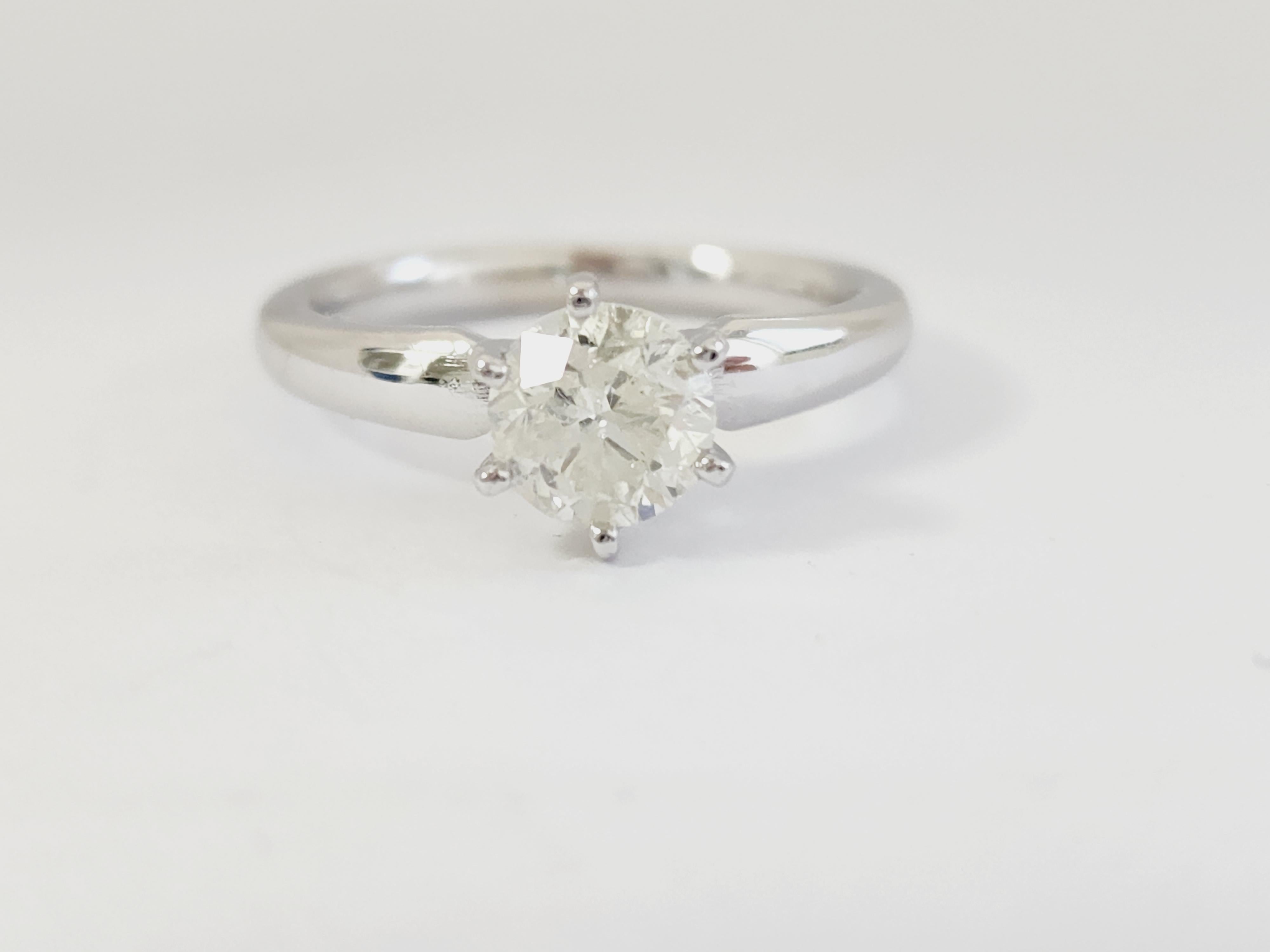 GIA 1.12 ct round brilliant cut natural diamonds. 6 prong solitaire setting, set in 14k white gold. Ring Size 6.75.