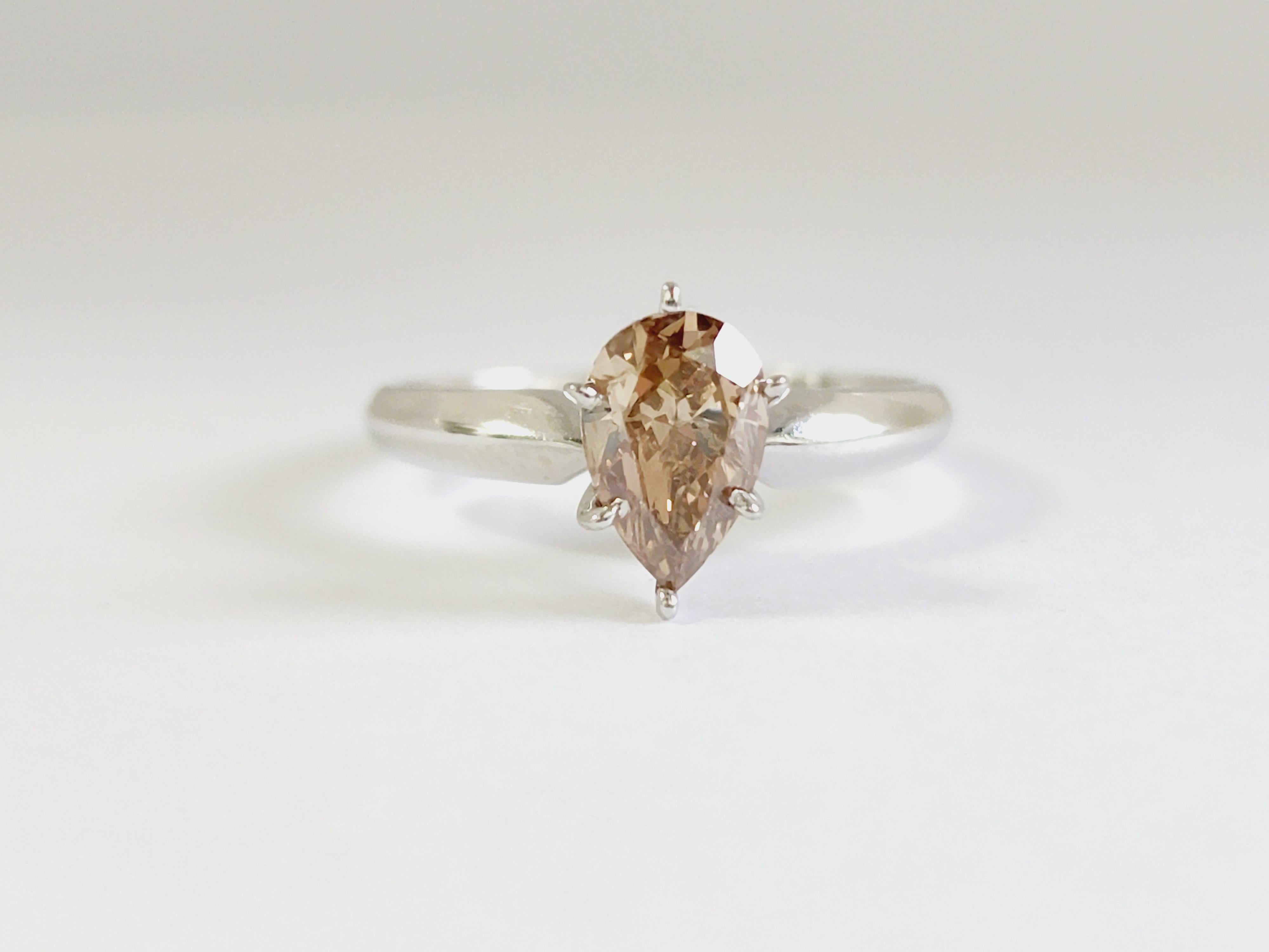 GIA 1.14 Carats pear shape natural diamond set on a 6 prong white gold 14 Karat solitaire Ring. 
Fancy Orangy-Brown, SI2
Ring Size 7