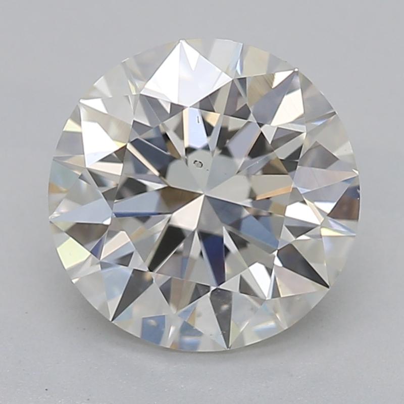 Dieser atemberaubende, in New York handgefertigte Diamantring besitzt einen atemberaubenden Mittelstein aus einem runden Diamanten mit einem Gewicht von 1,14 und einem exquisiten J mit einer Reinheitsstufe von SI1. Der Diamant ist in einer gedrehten