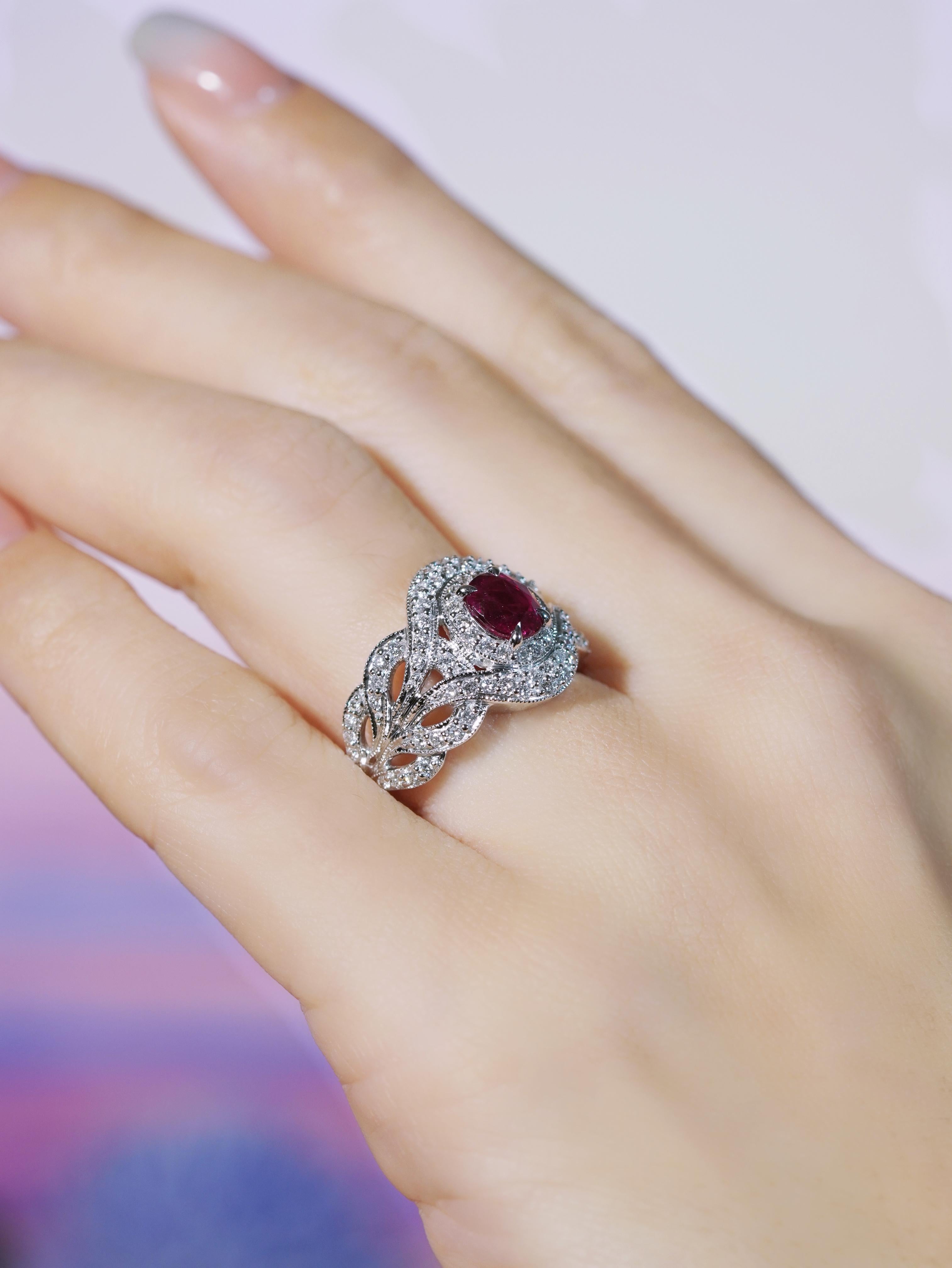 Elegant and timeless, this contemporary-style engagement ring features a rich GIA certified 1.15 carat ruby at its center, symbolizing passion and love. The shoulders are adorned with sparkling diamonds, gracefully arranged in a floral-inspired