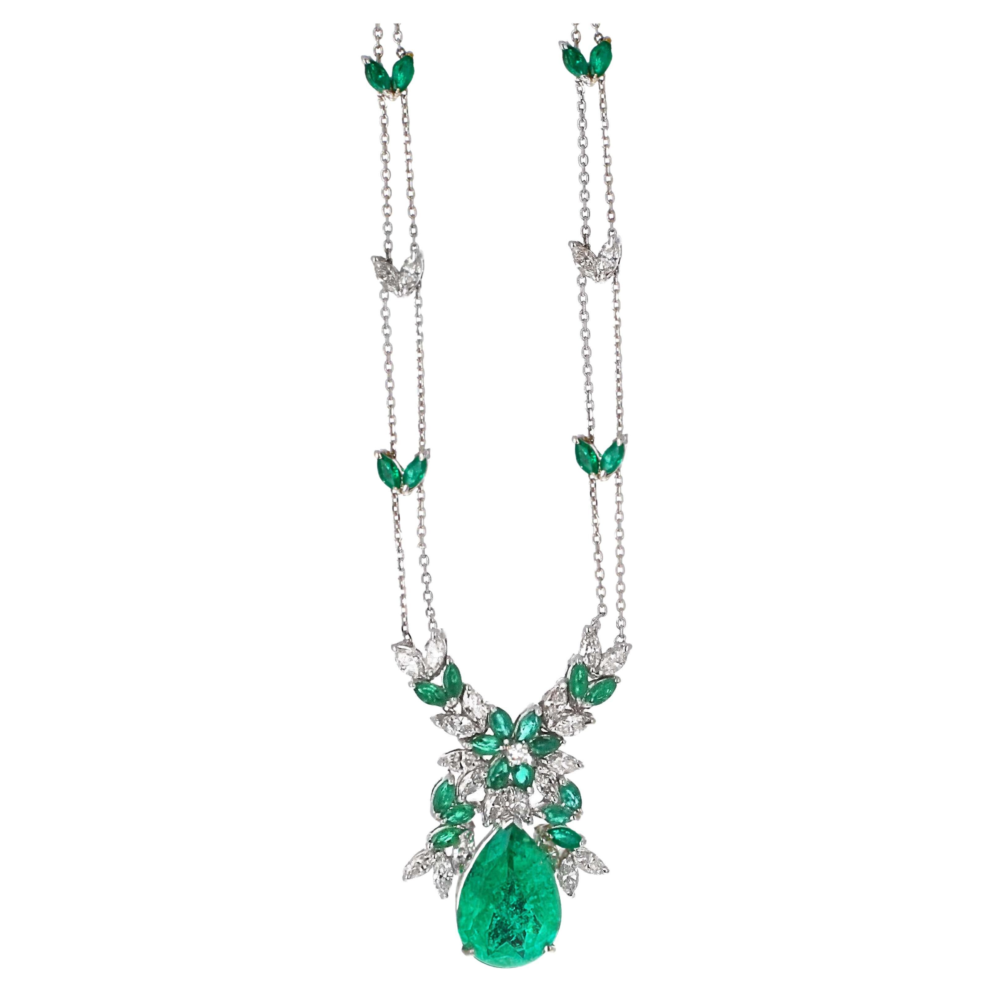 GIA certified Colombian pear shape emerald and diamond necklace pendant—a true gem of sophistication and elegance.
This pendant features a captivating 11.72-carat Colombian pear-shaped emerald, certified by GIA, measuring 19.91 x 13.95 x 8.45 mm.