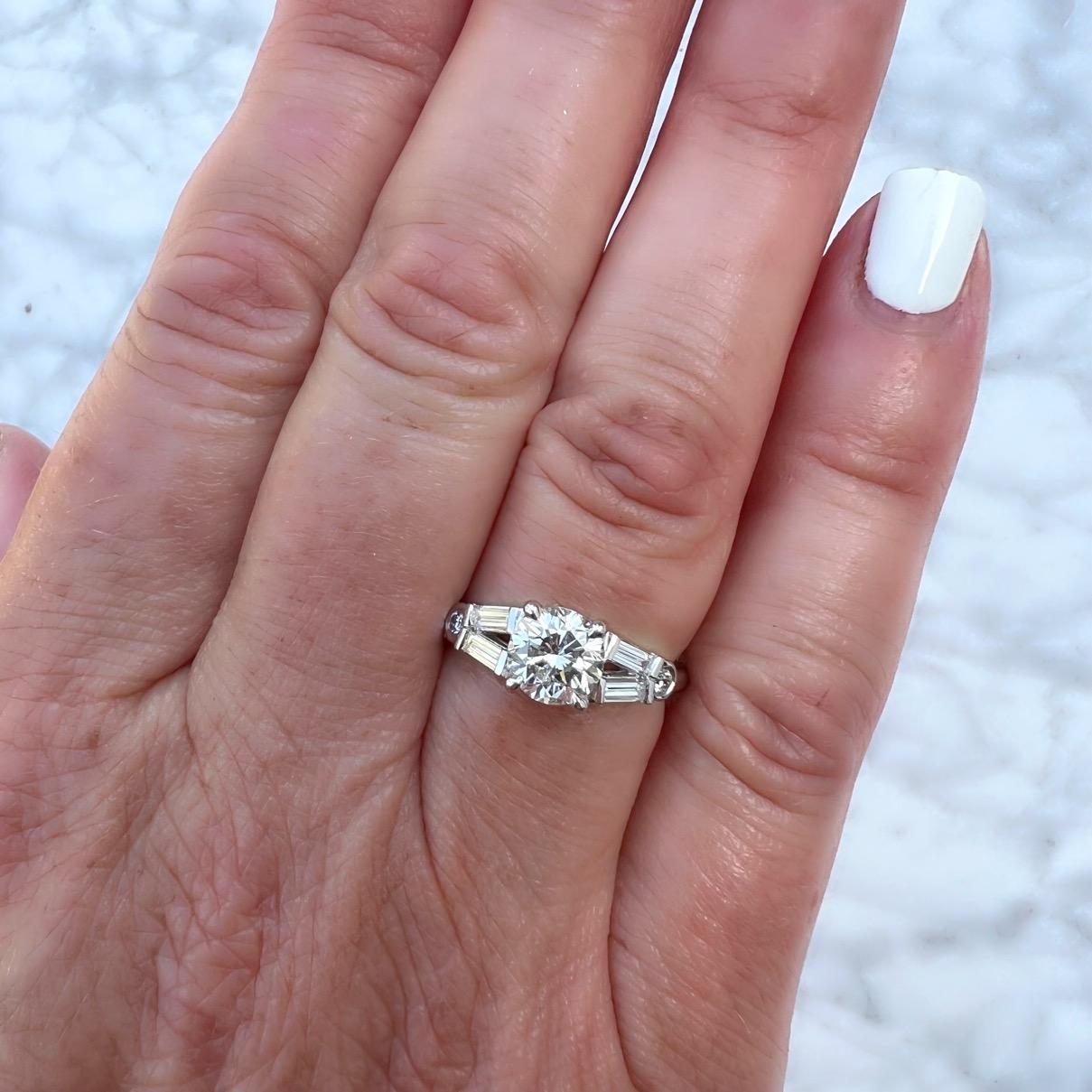 Look no further! This platinum diamond engagement ring might just be exactly what you were searching for. Featuring a fantastic 1.17 carat H/VVS2 round brilliant cut diamond as its centerpiece, this platinum stunner is highlighted by a split shank