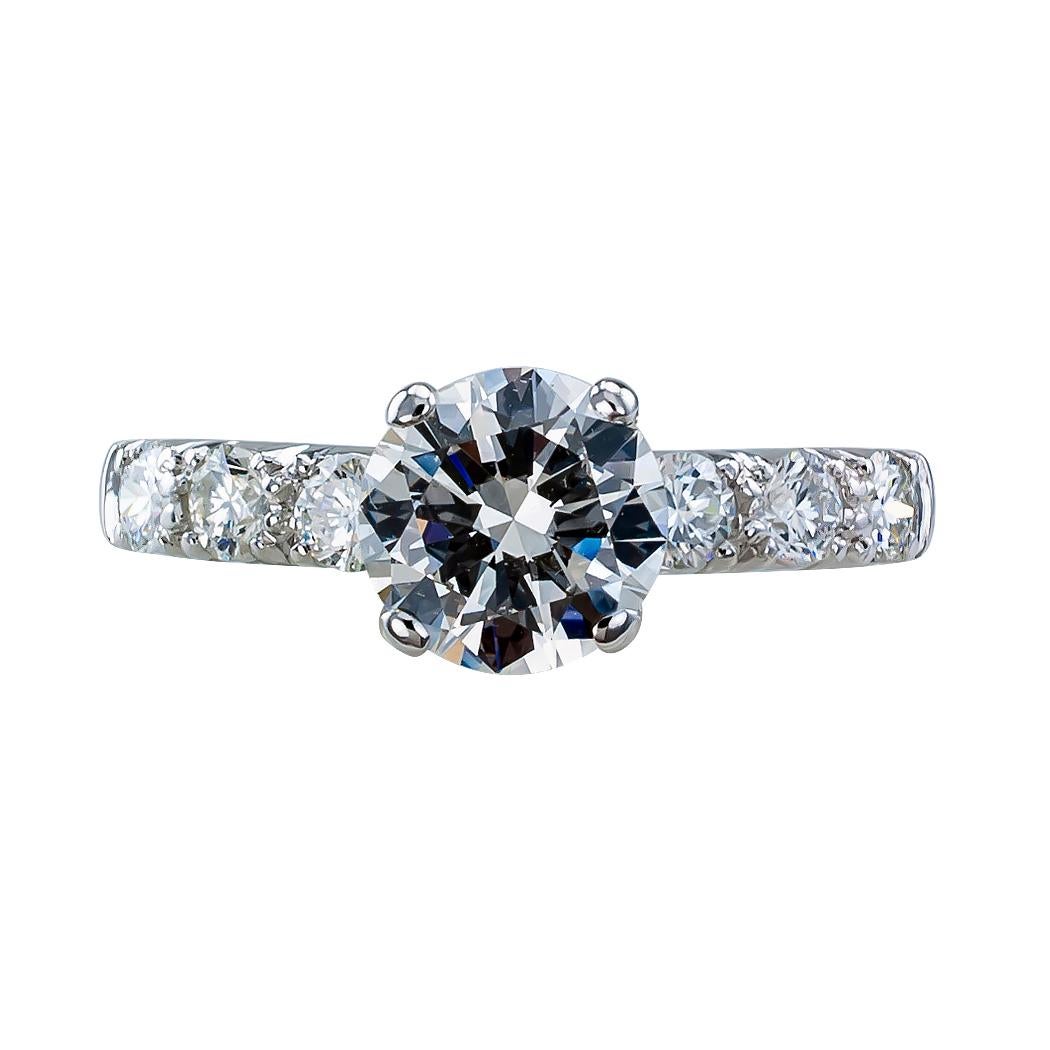 GIA 1.19 carat diamond engagement platinum ring circa 1950. Centering upon a round brilliant-cut diamond weighing 1.19 carats, accompanied by a report from GIA stating that the diamond is H color and VS2 clarity, between shoulders set with six