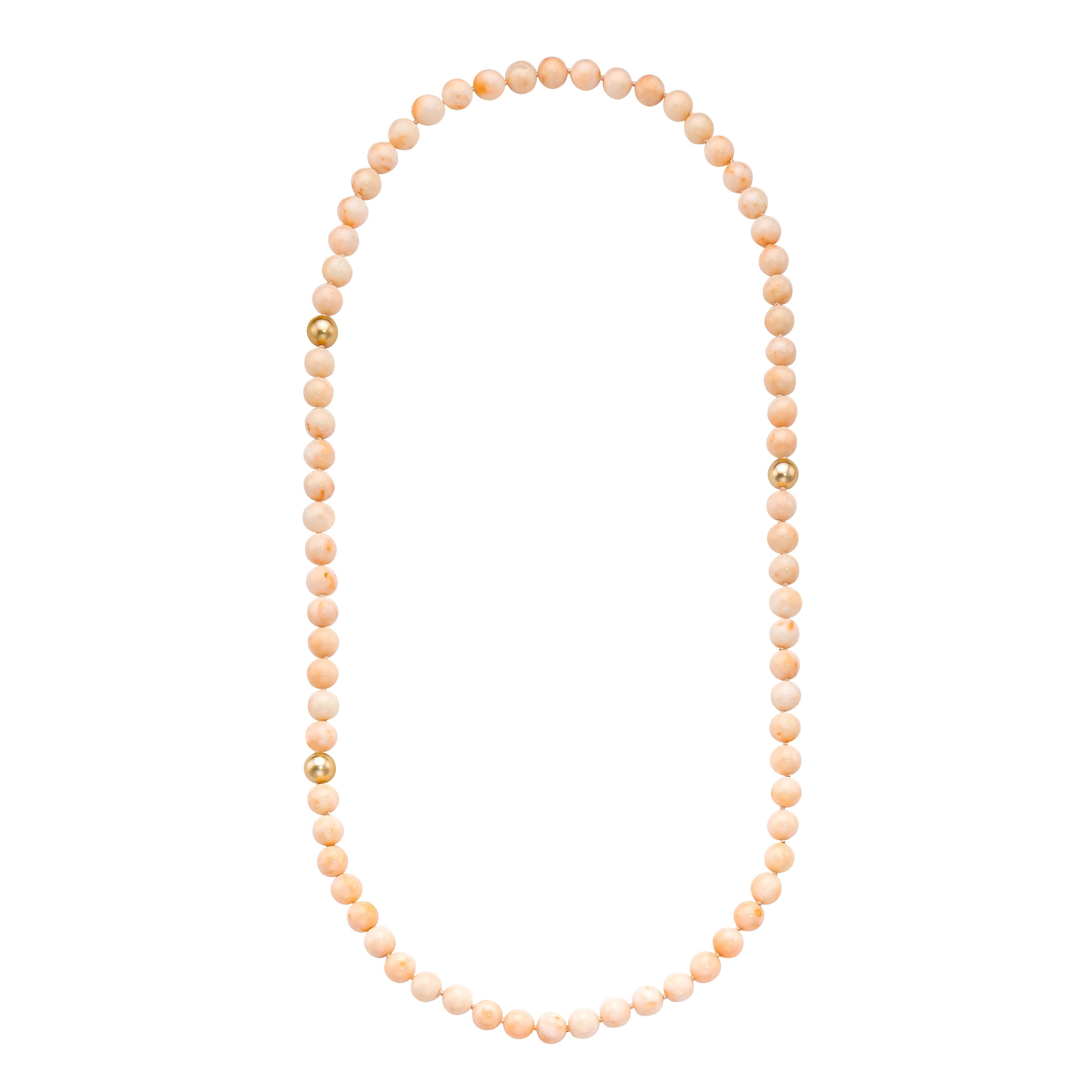Rare and Stunning!  Vintage Angel Skin Coral paired with the warm tones of South Sea Golden Pearls.  Hand-knotted endless strand style.

Necklace Details

(3) 12 mm South Sea Golden Pearls
     South Sea Report # 1216942903
(73) 12 mm Vintage Angel