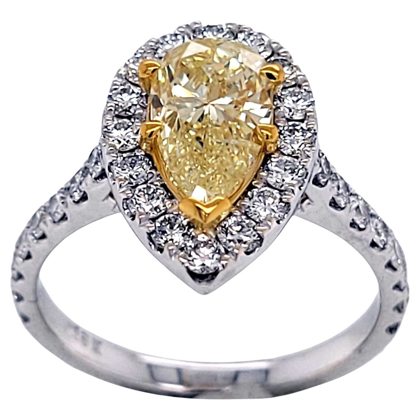 GIA 1.20 Carat Fancy Light Yellow Pear Shaped 18 Karat Gold Ring with Halo For Sale