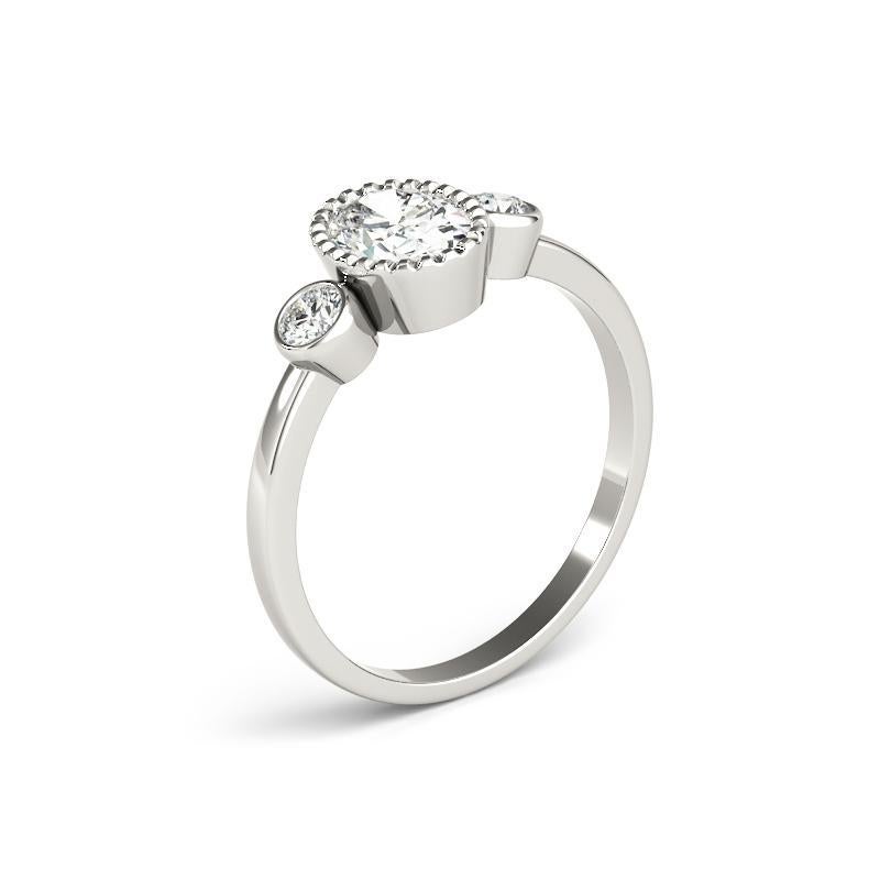 Women's GIA 1.20 Carat Oval Textured Bezel Three-Stone 18K White Gold Diamond Ring For Sale